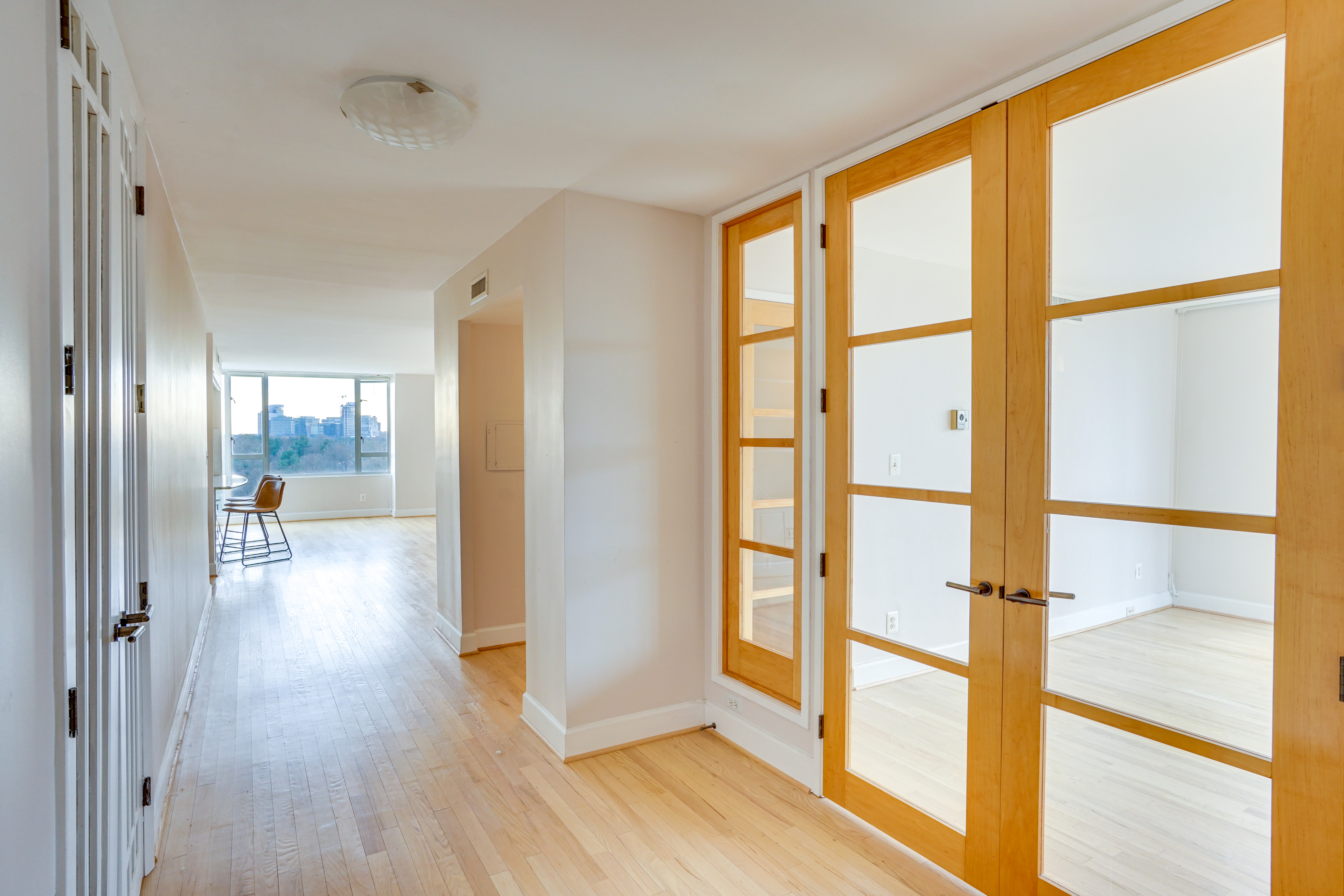 a view of an entryway with wooden floor