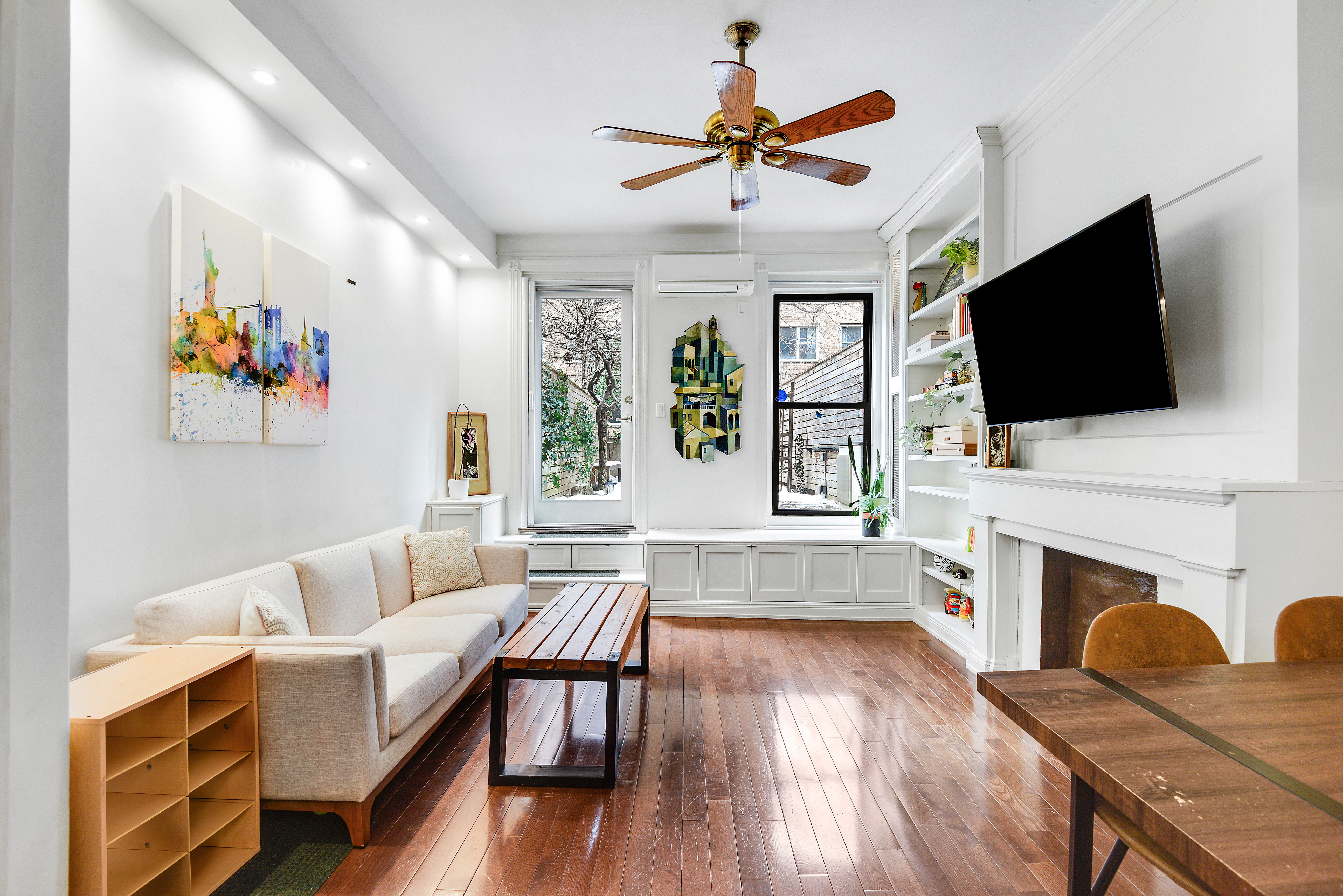 436 East 66th Street, Unit 1W Manhattan, NY 10065 - Photo 2 of 19 a living room with furniture fireplace and flat screen tv