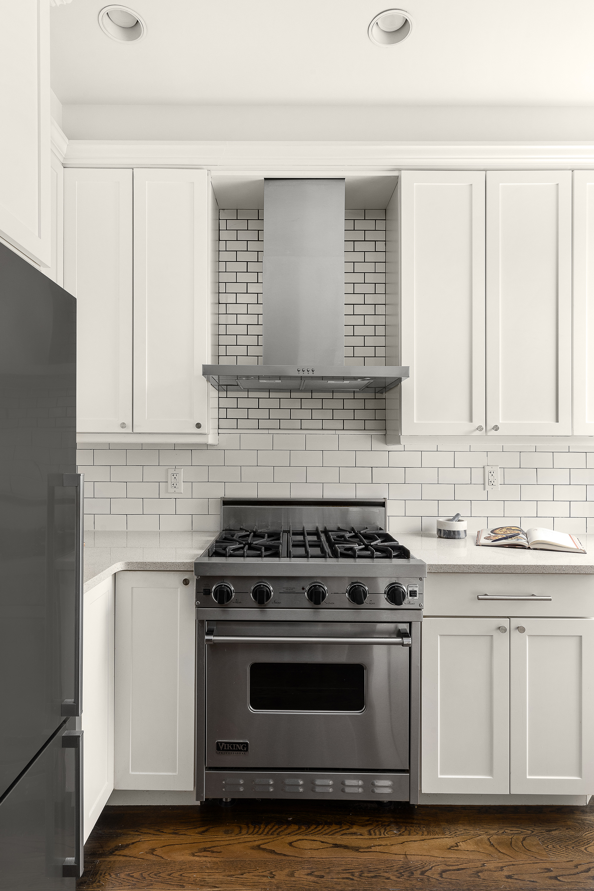 695 Degraw Street, Unit 2 Brooklyn, NY 11217 - Photo 5 of 11 a kitchen with granite countertop white cabinets and white appliances