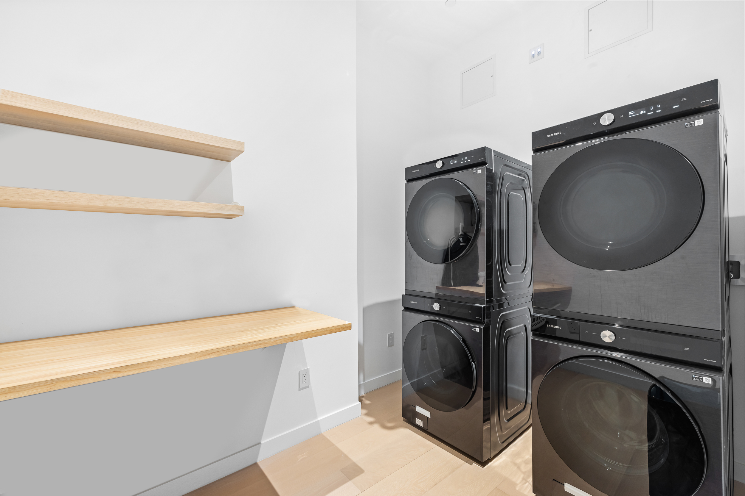 442 West 22nd Street Manhattan, NY 10011 - Photo 17 of 17 a utility room with dryer and washer