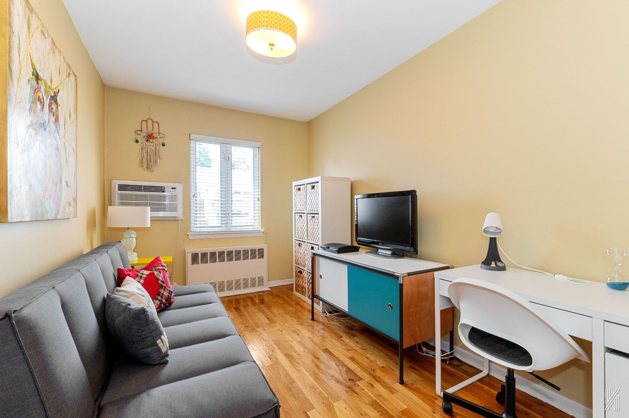 67-17 Eliot Avenue Queens, NY 11379 - Photo 10 of 21 a living room with furniture and a flat screen tv