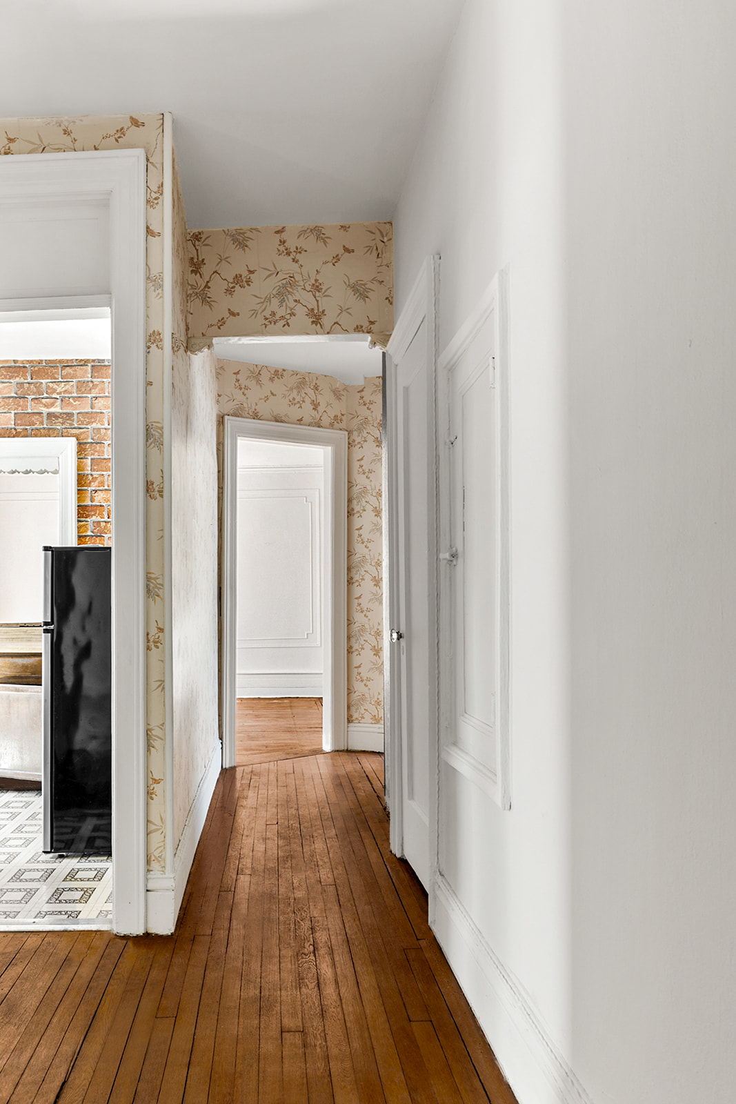 310 Windsor Place, Unit 32 Brooklyn, NY 11218 - Photo 13 of 19 a view of a hallway with wooden floor and staircase