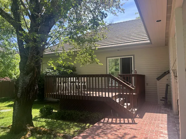 a living room with furniture and chandelier