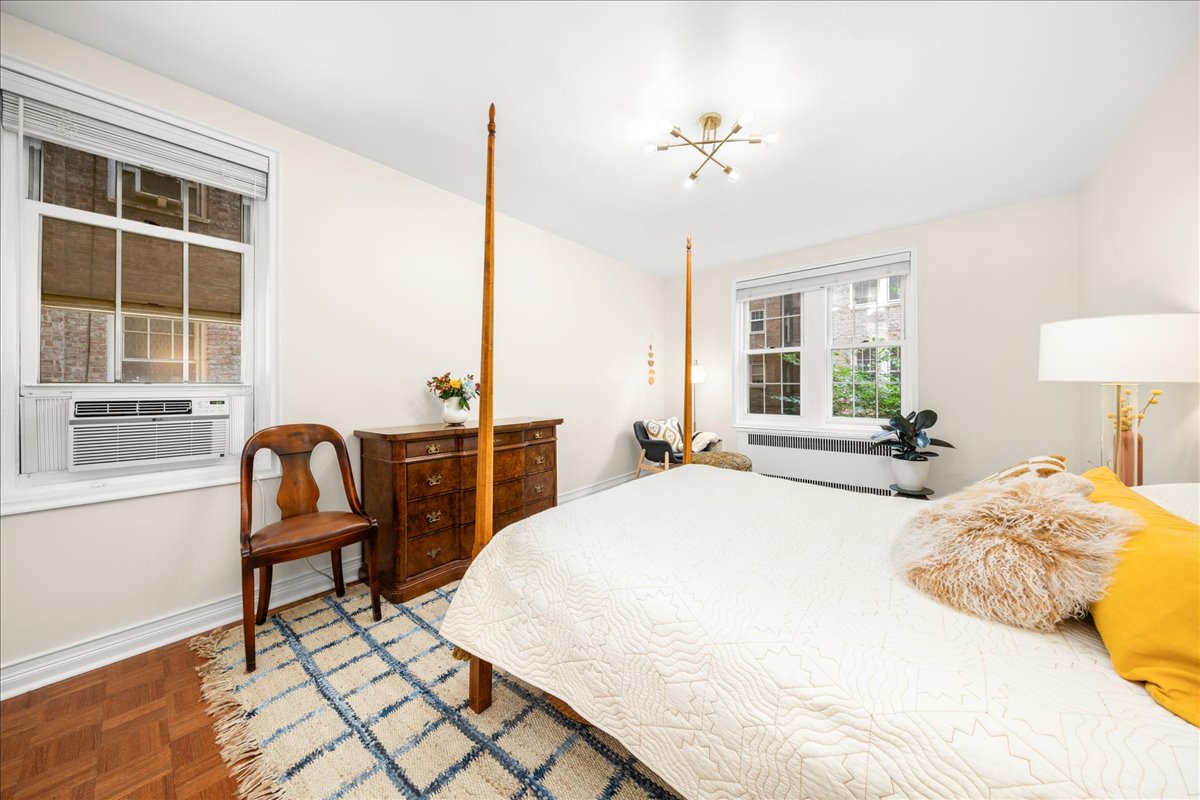 360 Clinton Avenue, Unit 1D Brooklyn, NY 11238 - Photo 10 of 17 a bedroom with a bed and a window