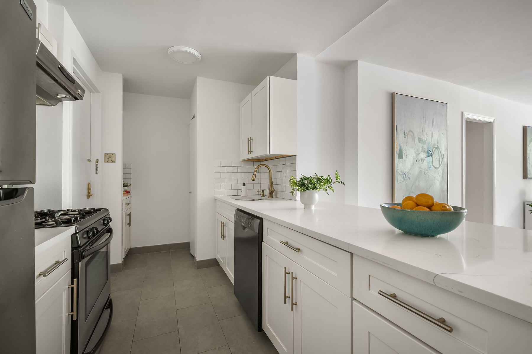 386 Columbus Avenue, Unit 2A Manhattan, NY 10024 - Photo 4 of 9 a kitchen with a sink and cabinets