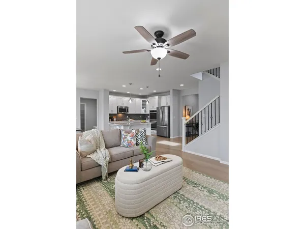 a kitchen with a refrigerator sink and wooden cabinets