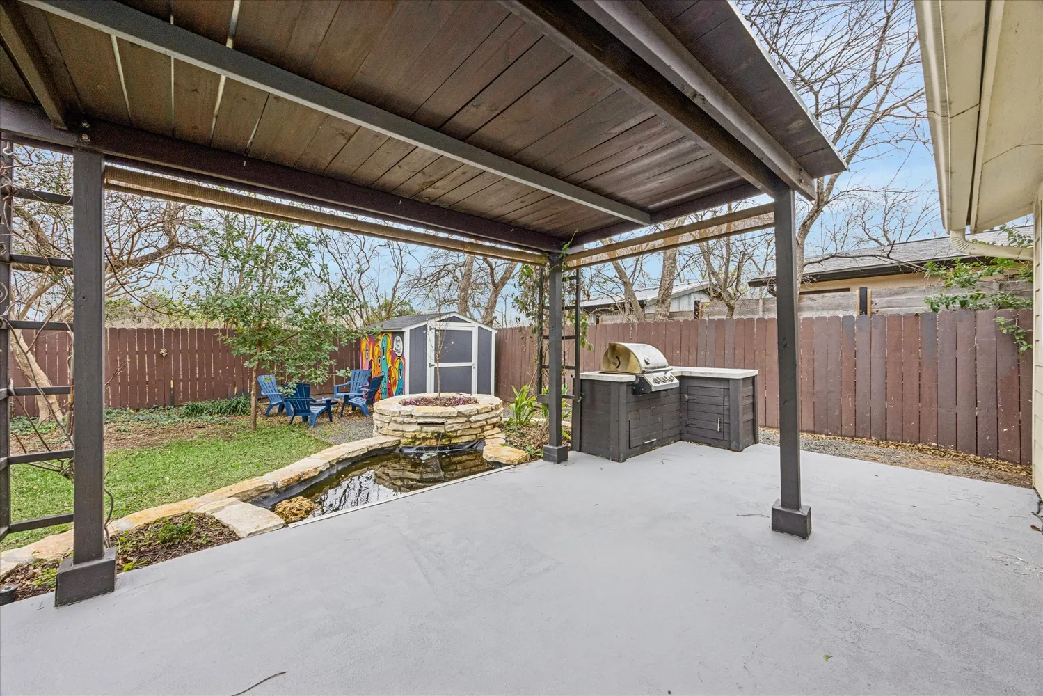 a view of a house with backyard porch and sitting area