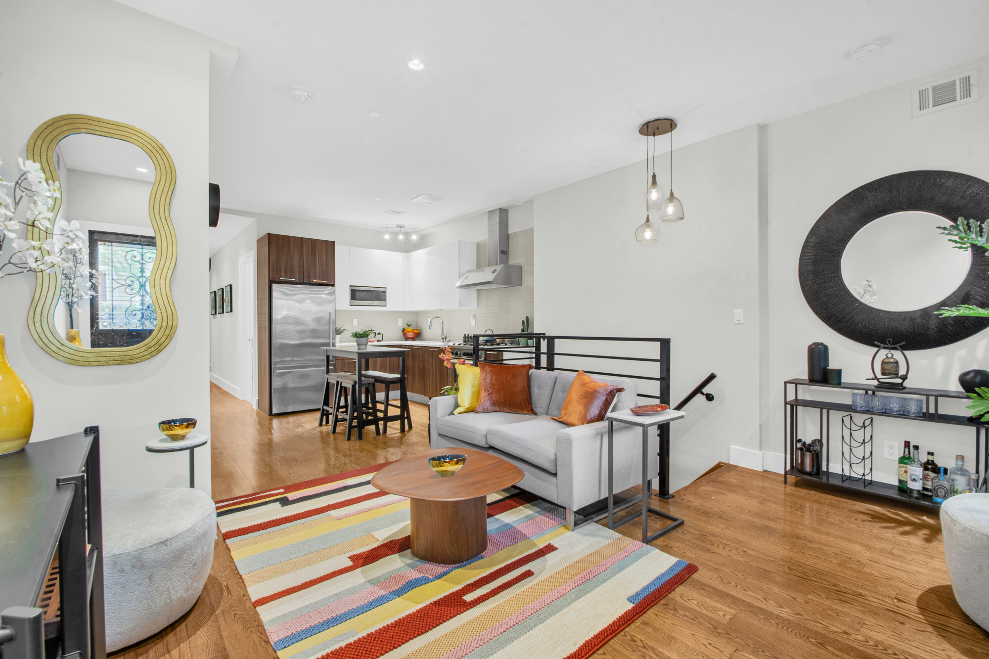 159 West 126th Street, Unit GARDEN A Manhattan, NY 10027 - Photo 2 of 15 a living room with furniture and wooden floor