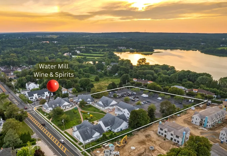 an aerial view of a house with a swimming pool and outdoor space
