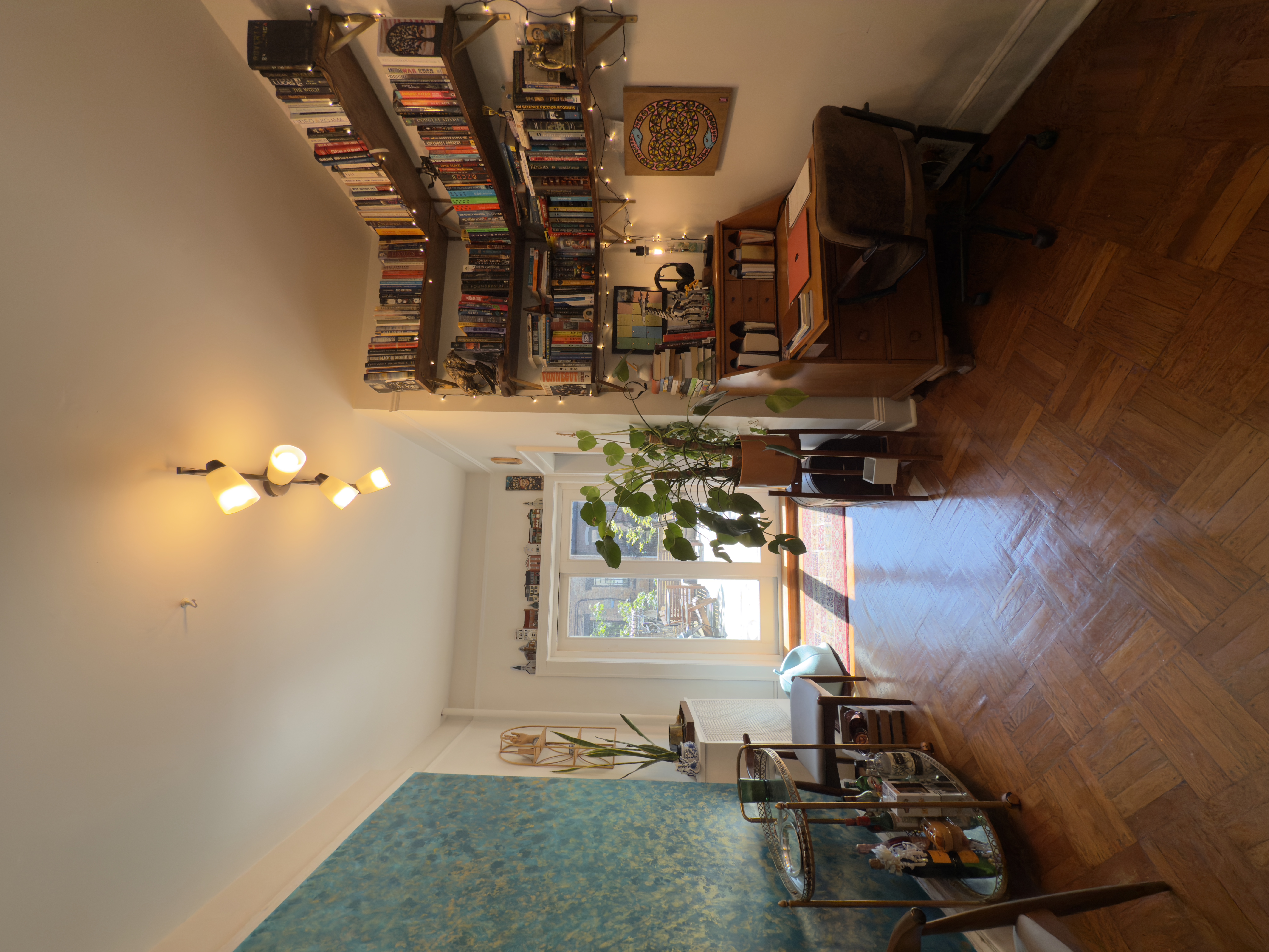141 7th Avenue, Unit 1 Brooklyn, NY 11215 - Photo 6 of 16 a living room with furniture and a chandelier