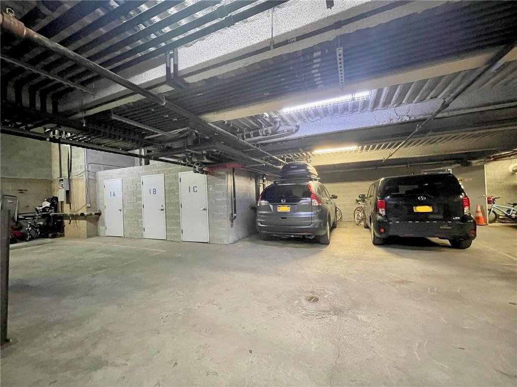 1638 8th Avenue, Unit 1B Brooklyn, NY 11215 - Photo 11 of 12 a view of parking garage with cars