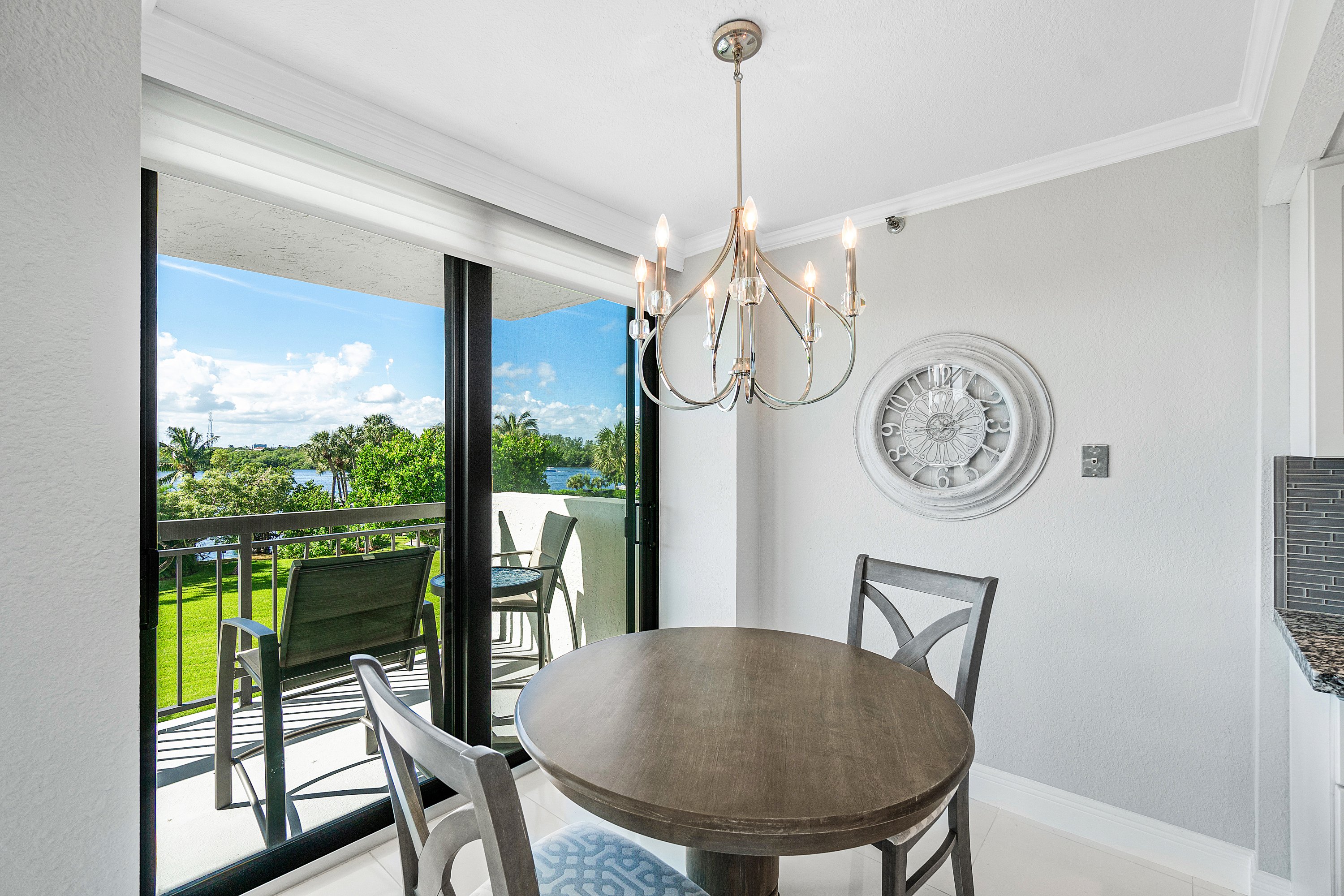 2003 North Ocean Boulevard, Unit 305 Boca Raton, FL 33431 - Photo 18 of 56 a view of a dining room with furniture window and outside view