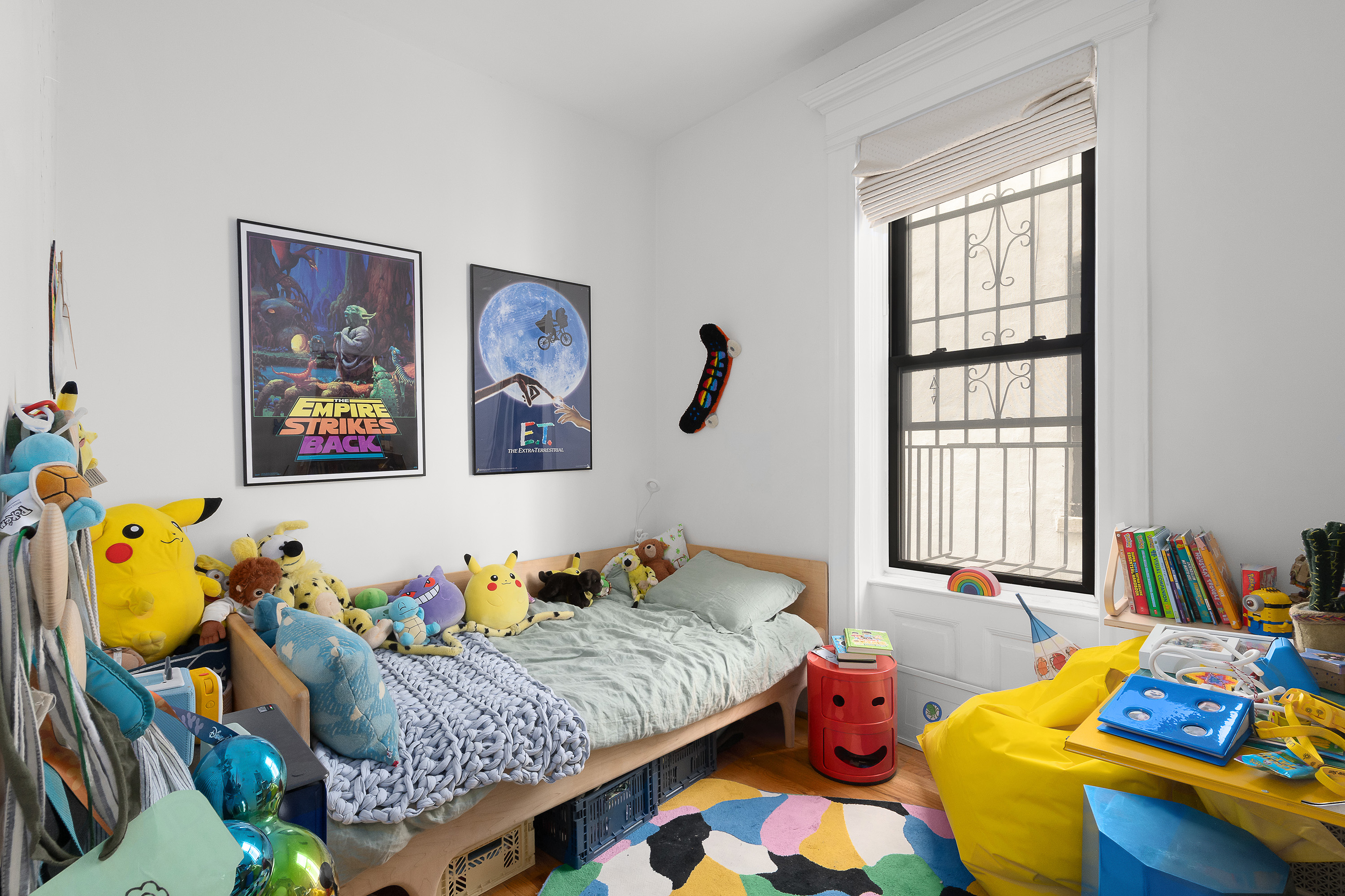 226 St James Place, Unit 1R Brooklyn, NY 11238 - Photo 10 of 14 a bedroom with a bed and a couch