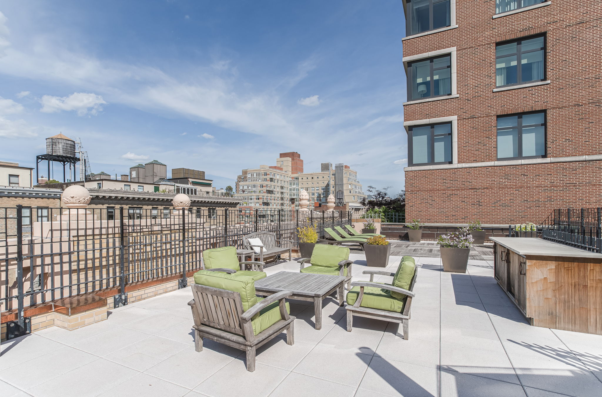 302 West 86th Street, Unit 11C Manhattan, NY 10024 - Photo 13 of 16 a roof deck with couch and chairs