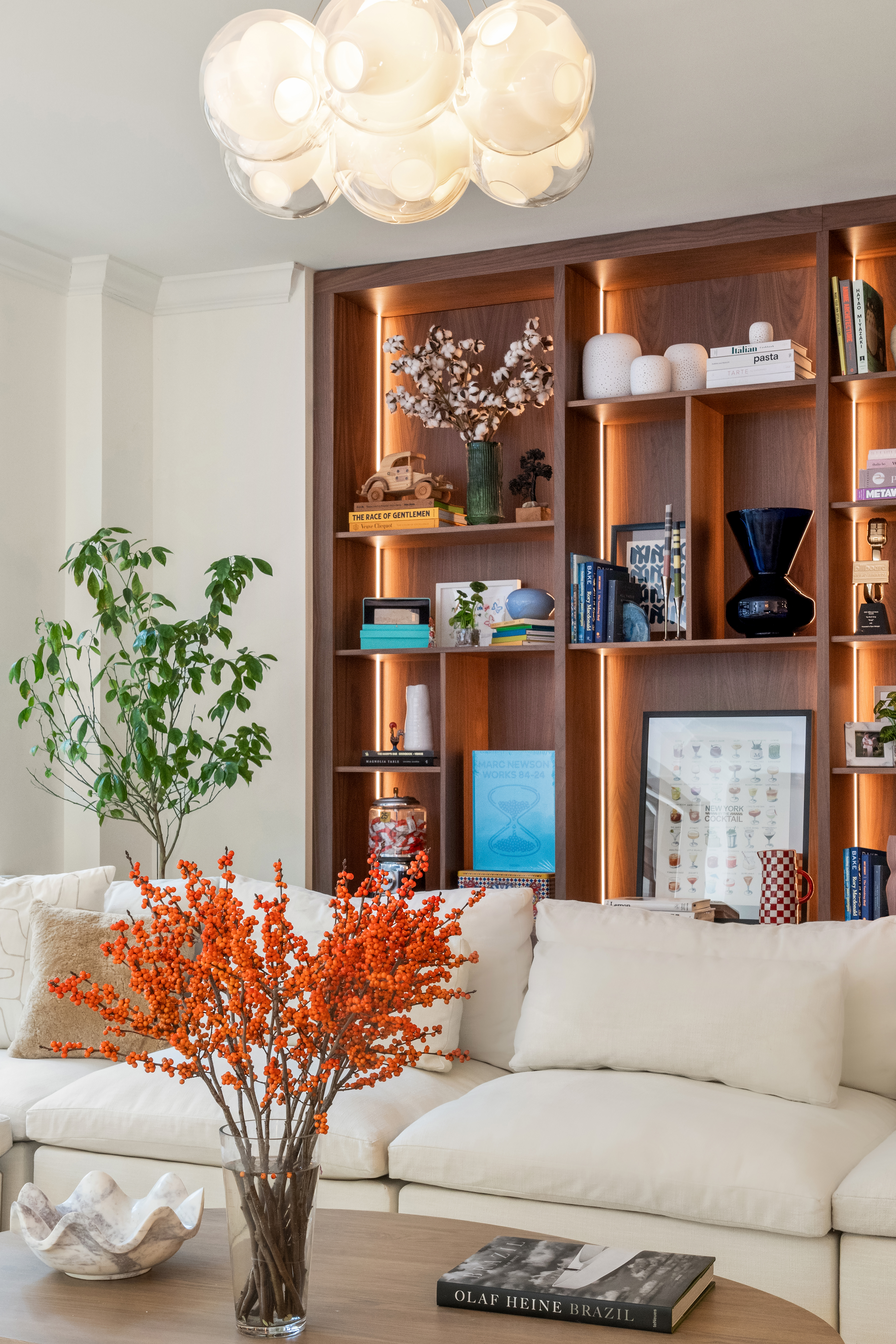 199 Mott Street, Unit 2 Manhattan, NY 10012 - Photo 3 of 14 a living room with a large window and a fireplace