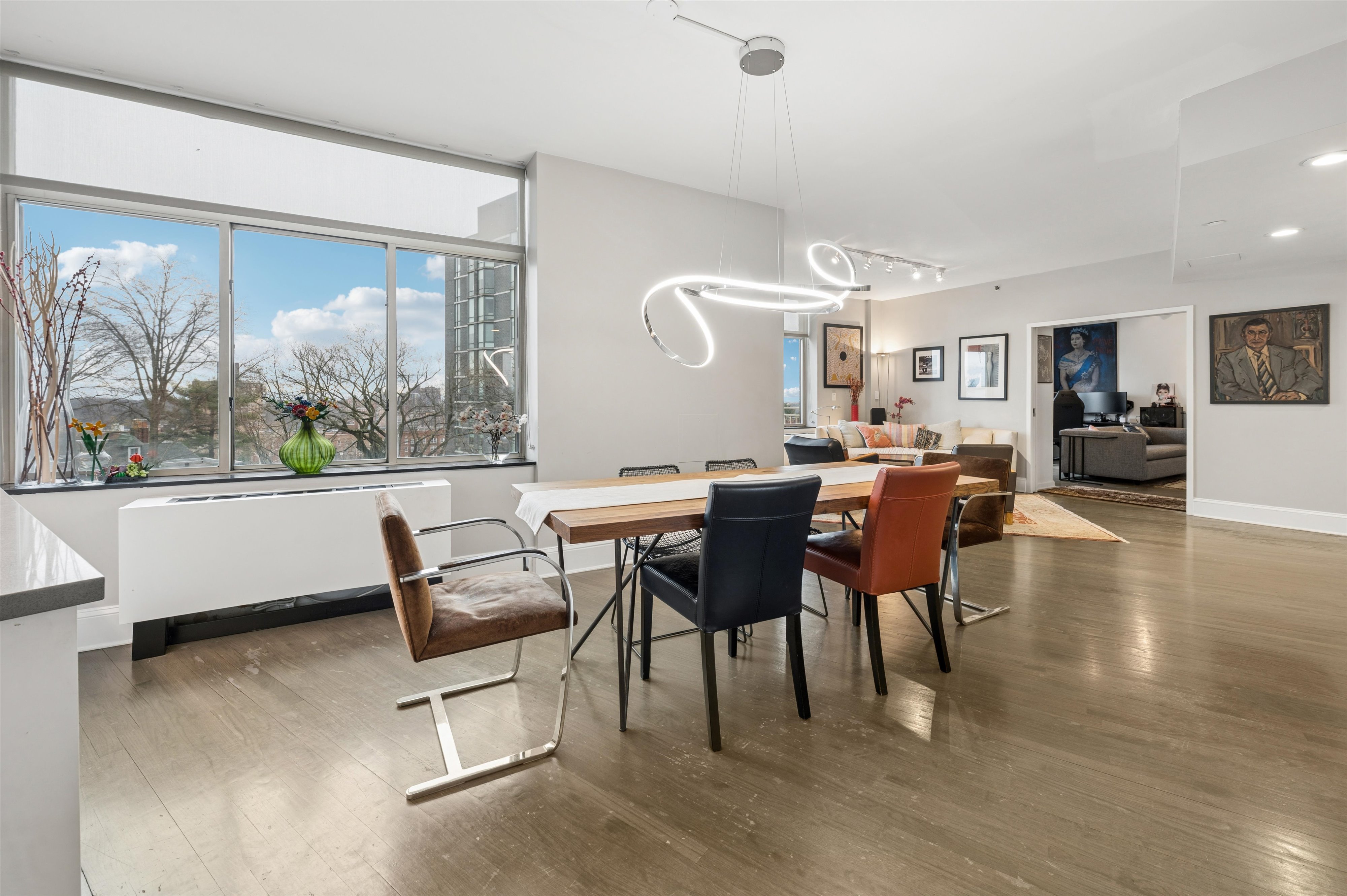3625 Oxford Avenue, Unit 7C Bronx, NY 10463 - Photo 2 of 20 a view of a dining room with furniture window and wooden floor