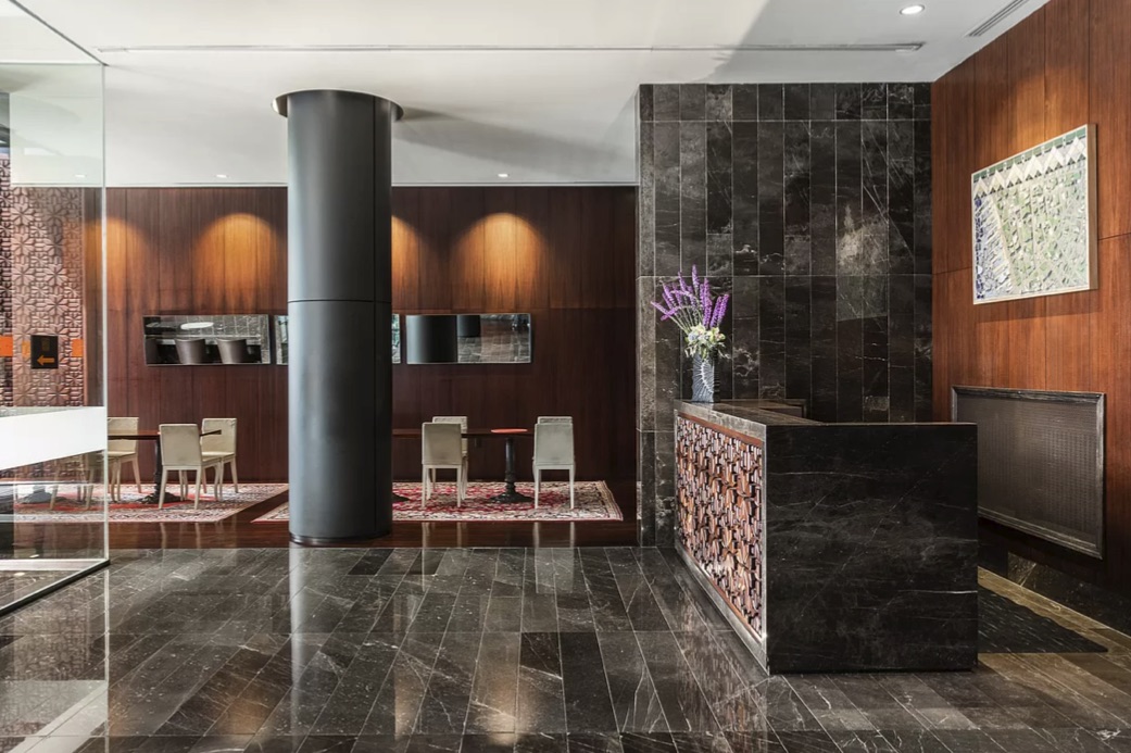 88 Greenwich Street, Unit 3003 Manhattan, NY 10006 - Photo 18 of 19 a room with lots of wooden furniture