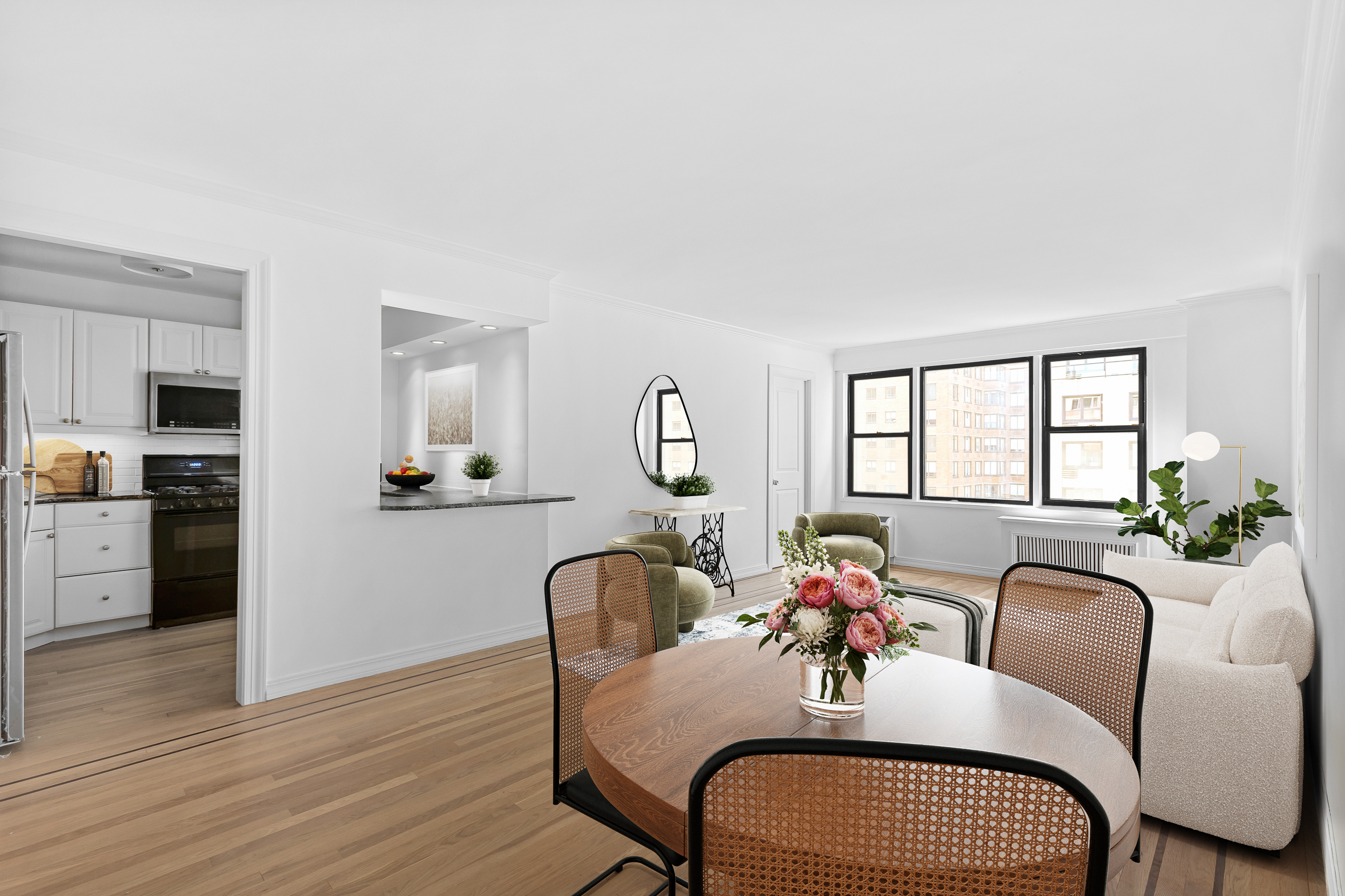 333 East 34th Street, Unit 14D Manhattan, NY 10016 - Photo 2 of 11 a view of a dining room with furniture window and wooden floor
