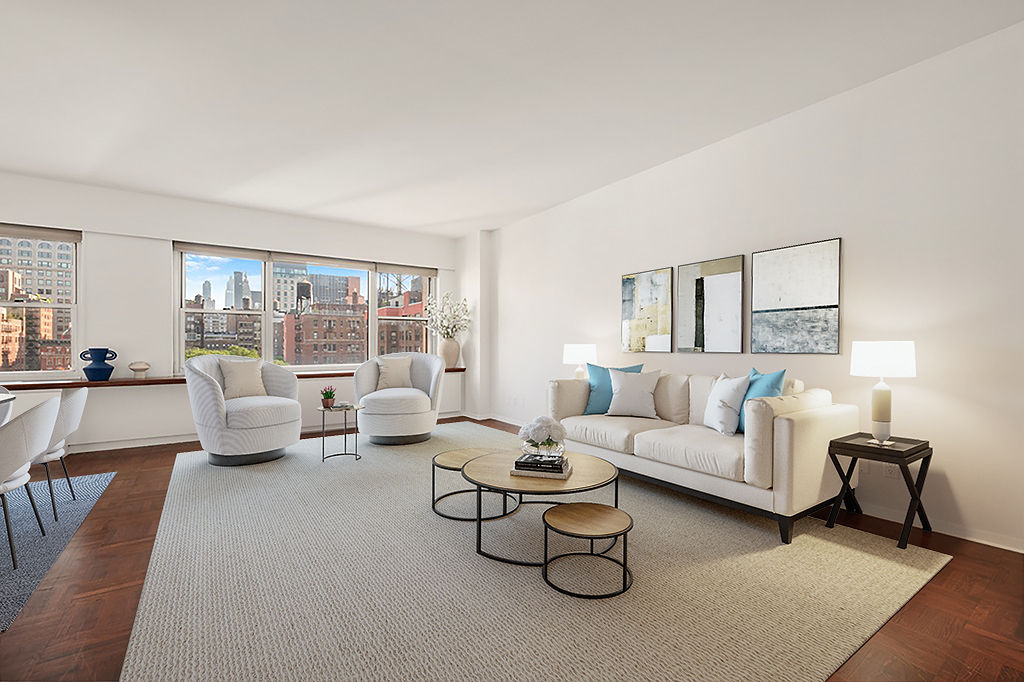 a living room with furniture and a large window with balcony view