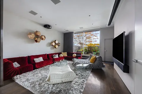a living room with furniture fireplace and window