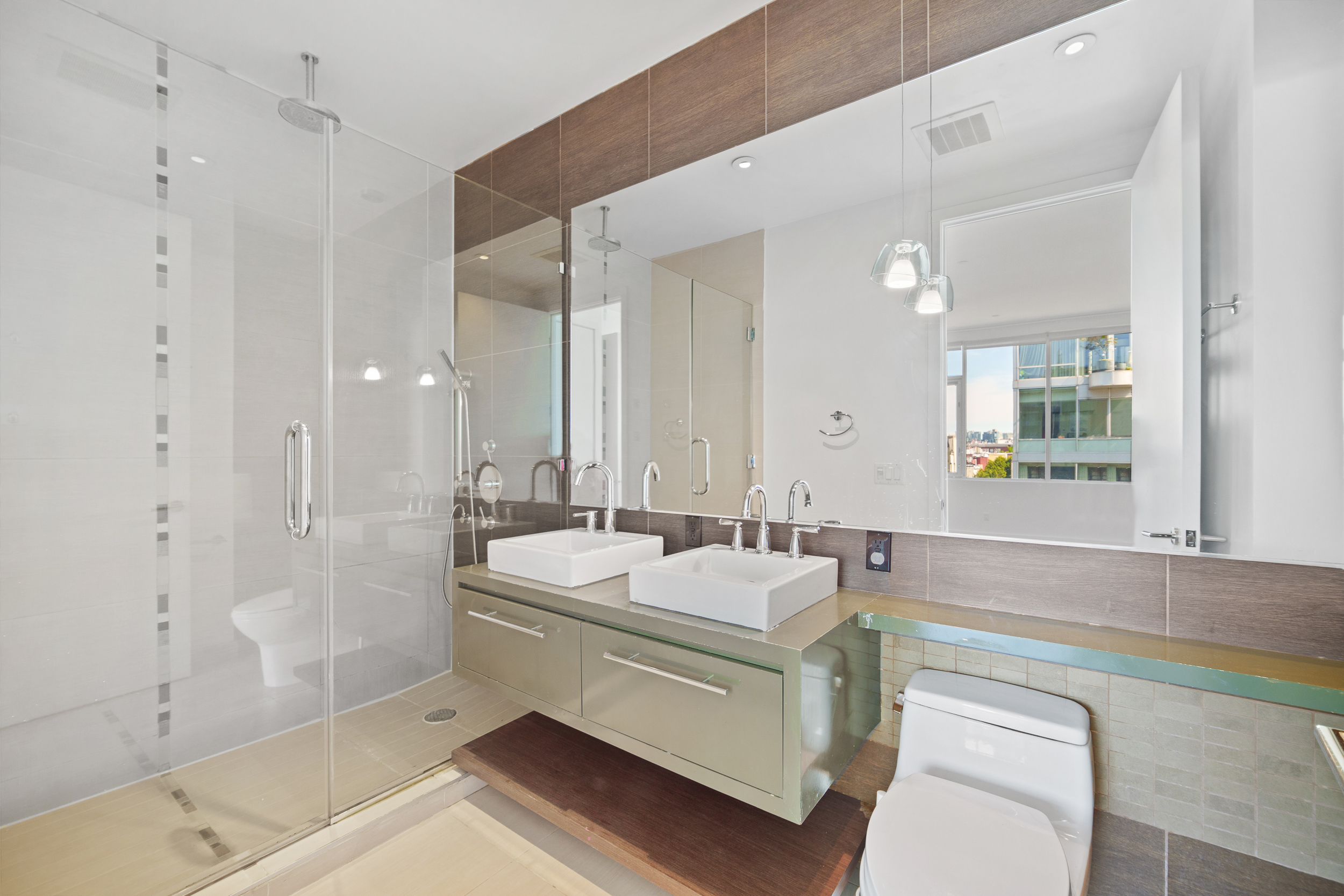 170 North 11th Street, Unit 5B Brooklyn, NY 11211 - Photo 7 of 11 a bathroom with a sink a mirror and a bathtub