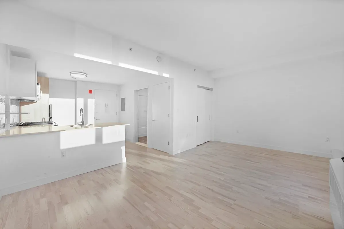 a view of kitchen with wooden floor