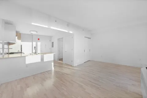 a view of kitchen with wooden floor