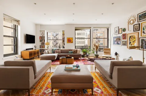 a living room with fireplace furniture and a flat screen tv