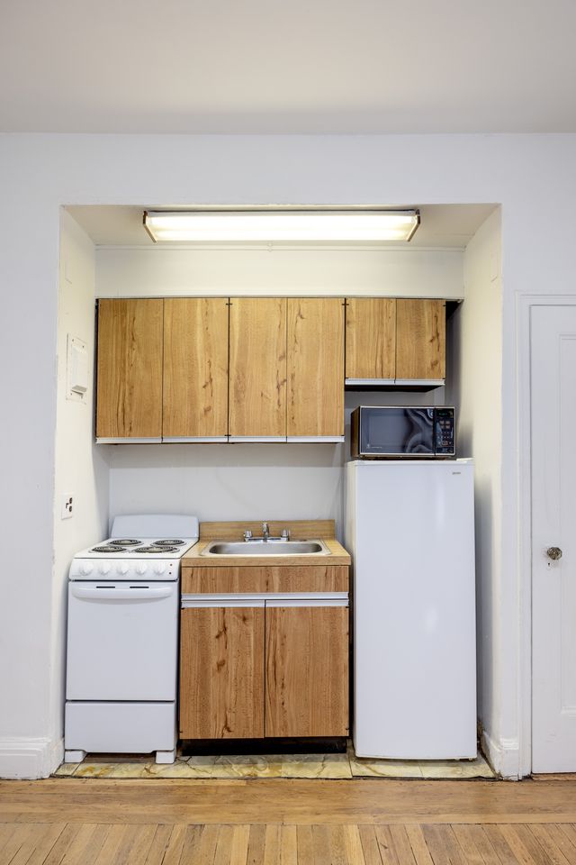 325 West 45th Street, Unit 108 Manhattan, NY 10036 - Photo 3 of 12 a utility room with washer and dryer