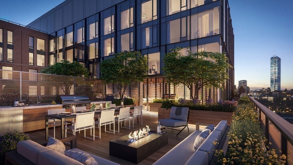 380 Harrison Avenue, Unit 1005 Boston, MA 02118 - Photo 12 of 14 a view of a patio with couches table and chairs and potted plants