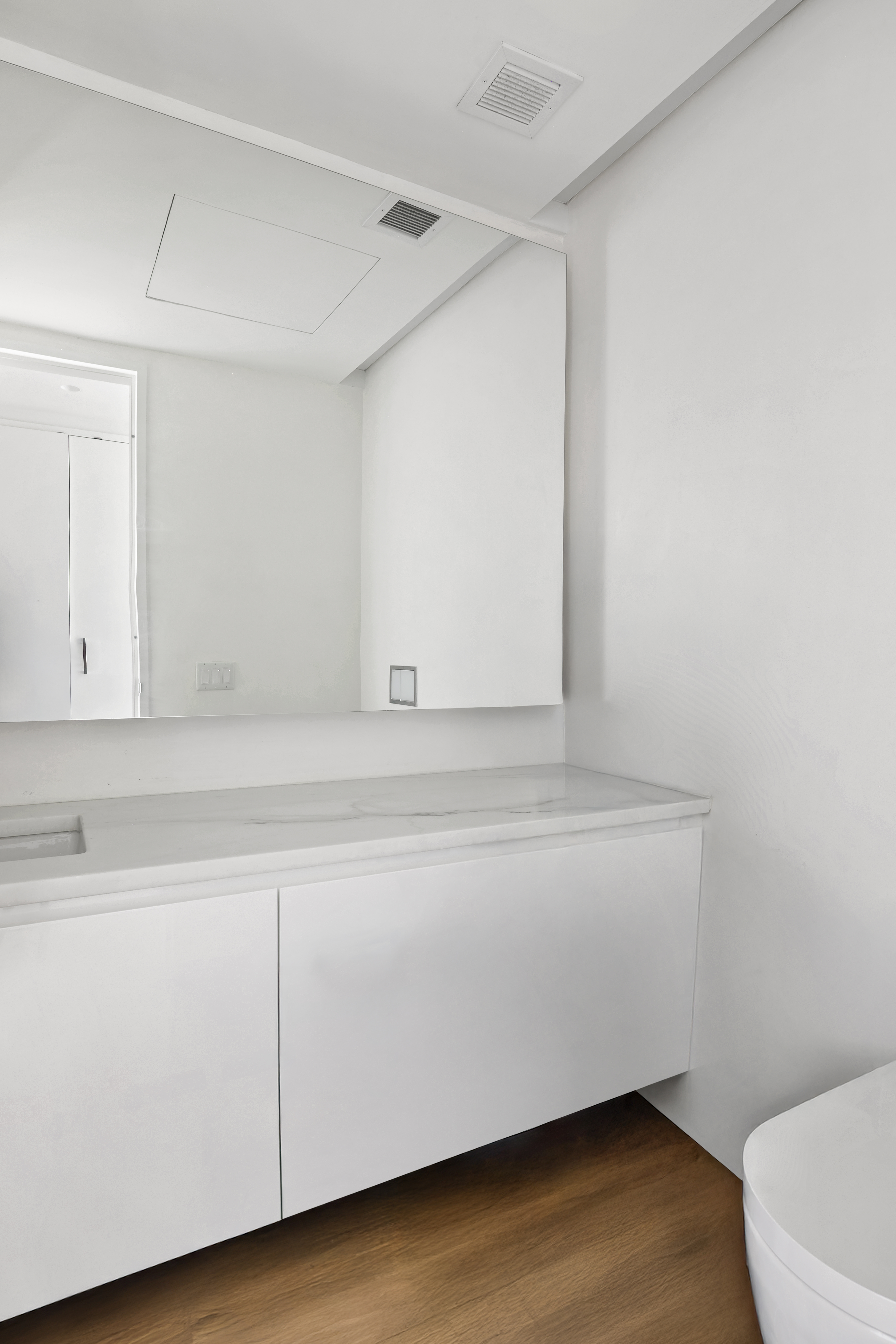 695 1st Avenue, Unit 33B Manhattan, NY 10016 - Photo 9 of 25 a bathroom with a sink and a toilet