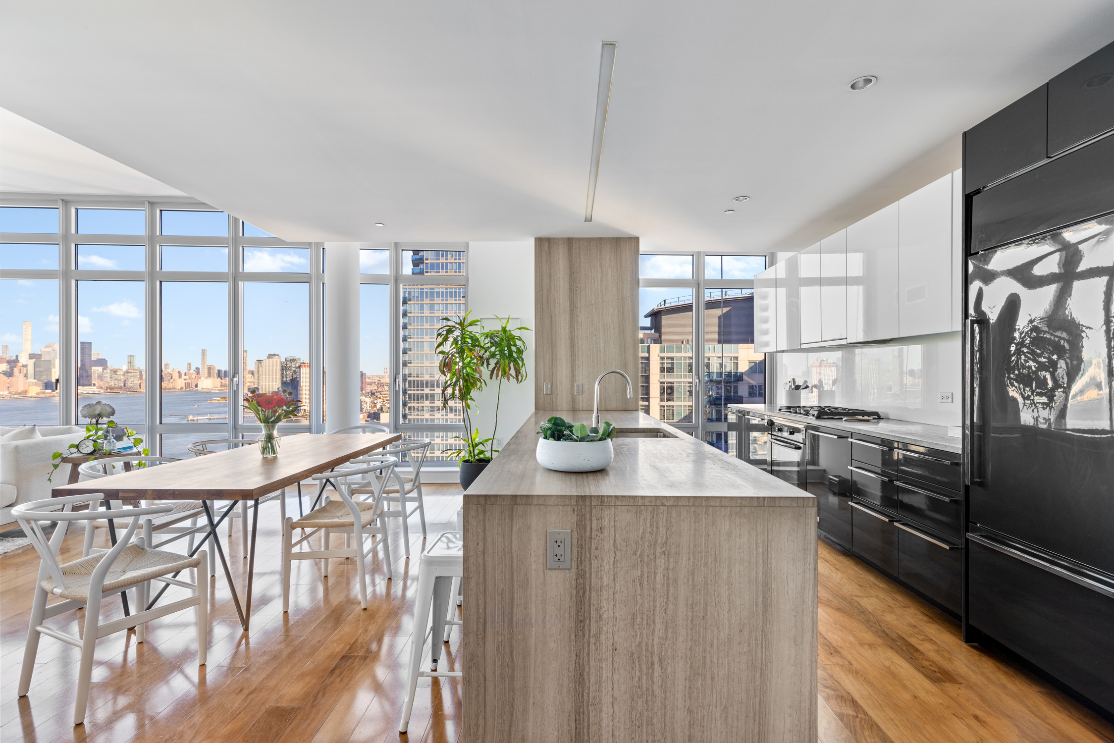 2 Northside Piers, Unit 31P Brooklyn, NY 11249 - Photo 5 of 16 a kitchen with counter top space and wooden floor