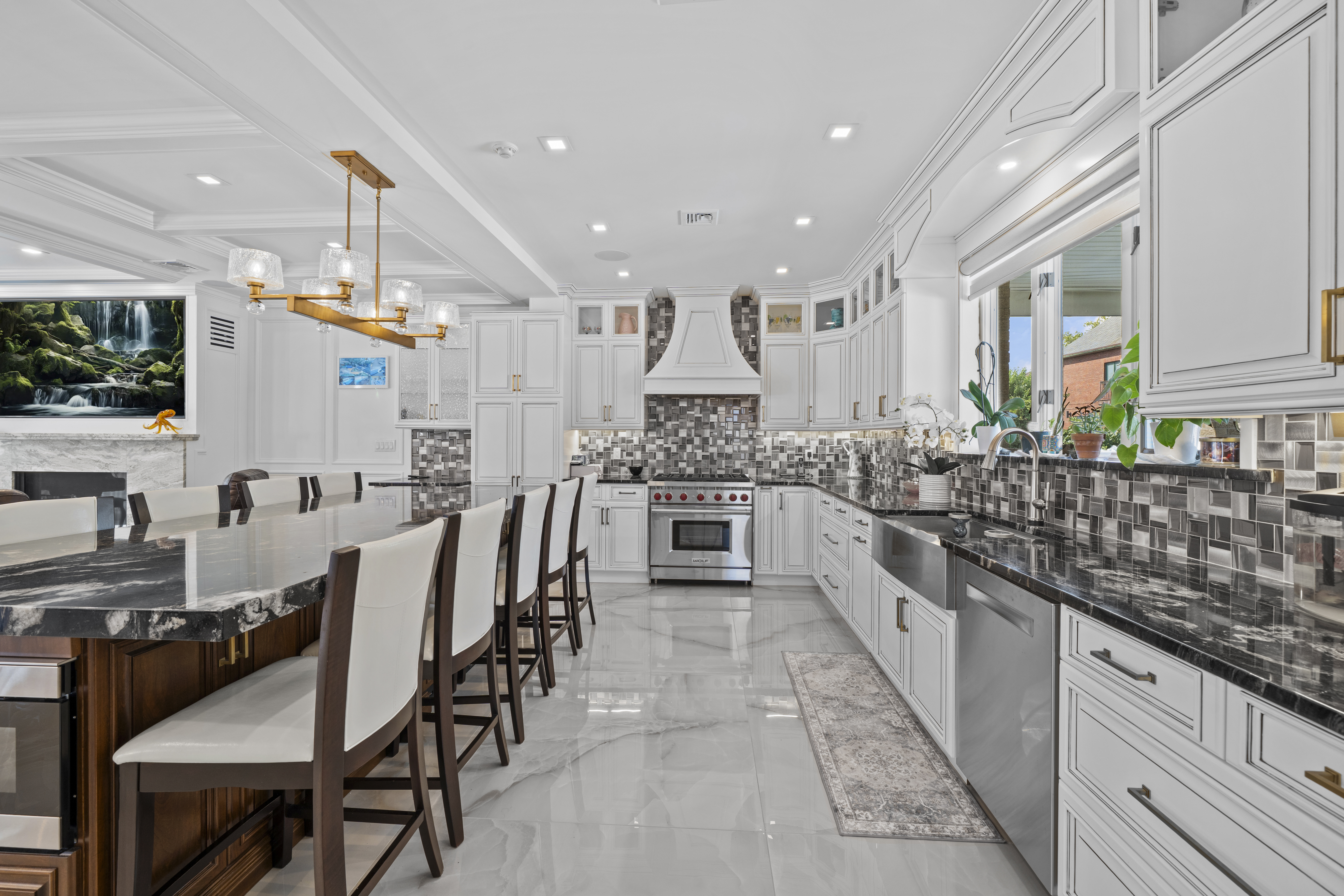2253 East 64th Street Brooklyn, NY 11234 - Photo 9 of 45 a large kitchen with cabinets table and chairs