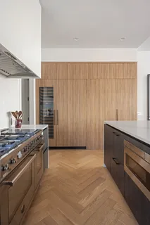 a kitchen with stainless steel appliances a stove and a refrigerator