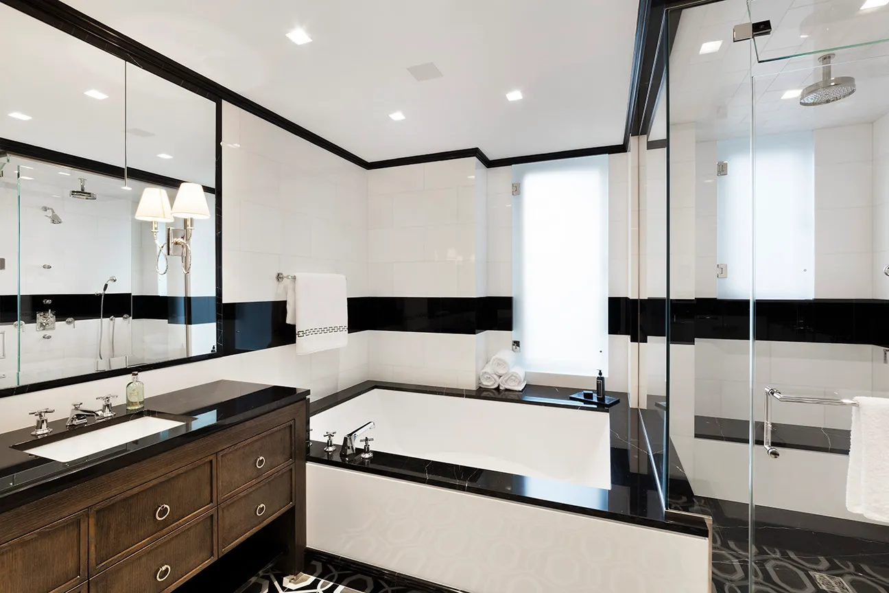 a bathroom with a double vanity sink and mirror