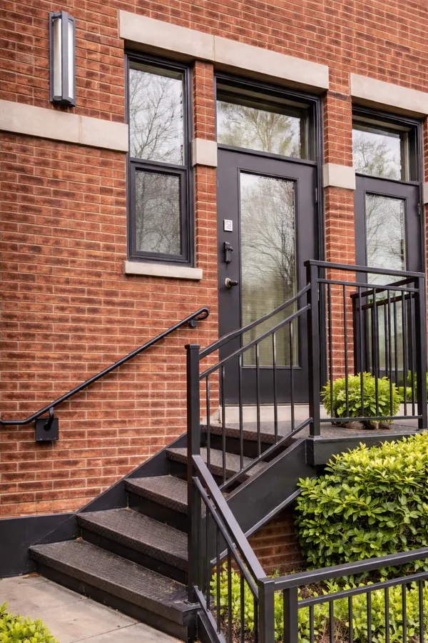 a view of a brick house with a large windows