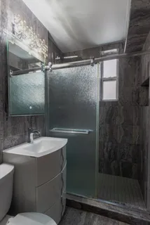 a bathroom with a sink and mirror