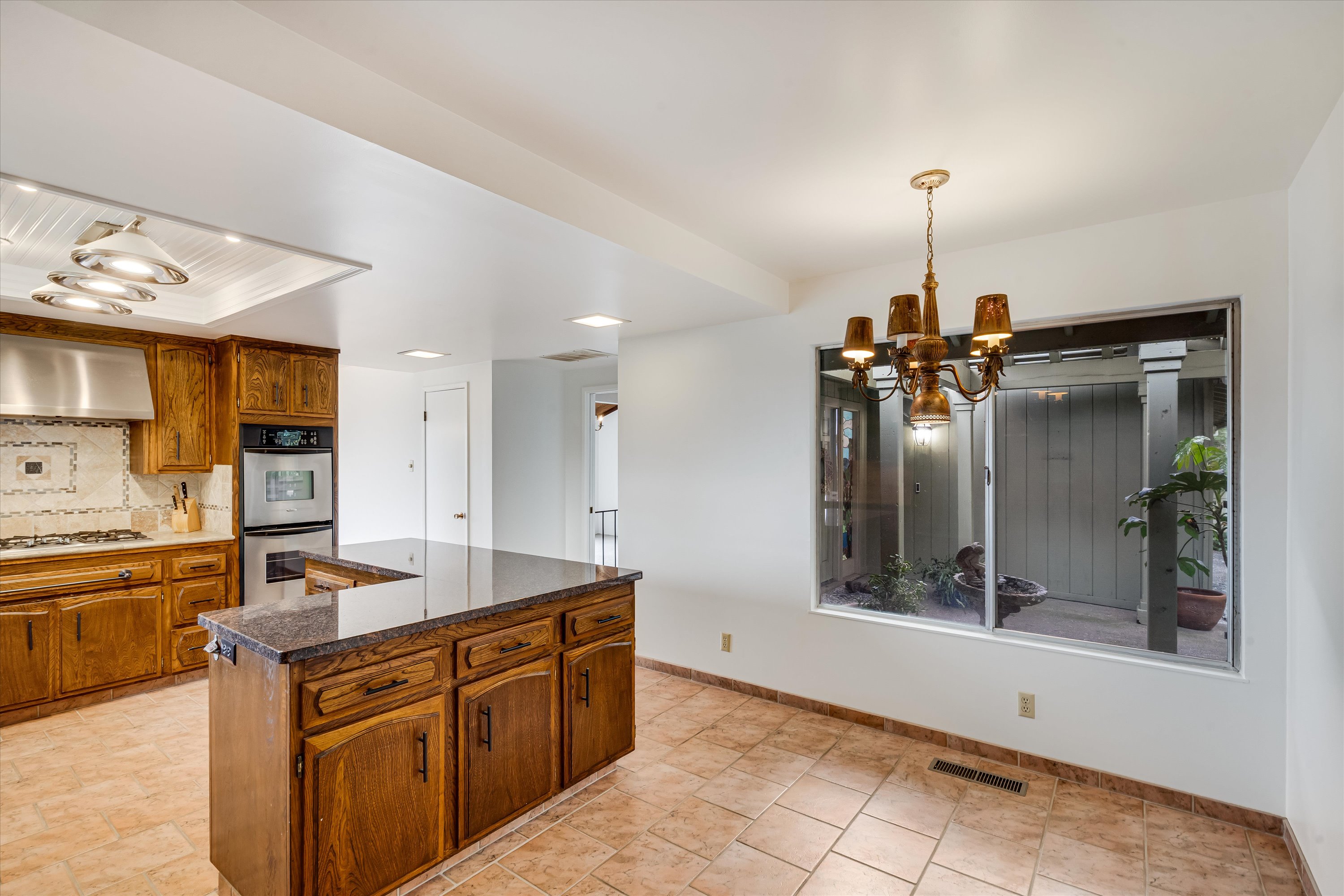 1291 Rockland Drive St. Helena, CA 94574 - Photo 7 of 26 a kitchen with stainless steel appliances granite countertop a sink and cabinets