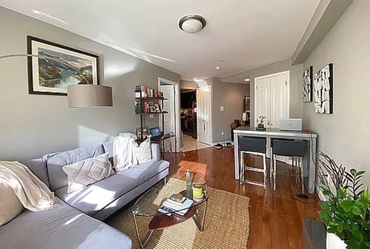 456 West 167th Street, Unit 6C Manhattan, NY 10032 - Photo 3 of 11 a living room with furniture kitchen view and a potted plant