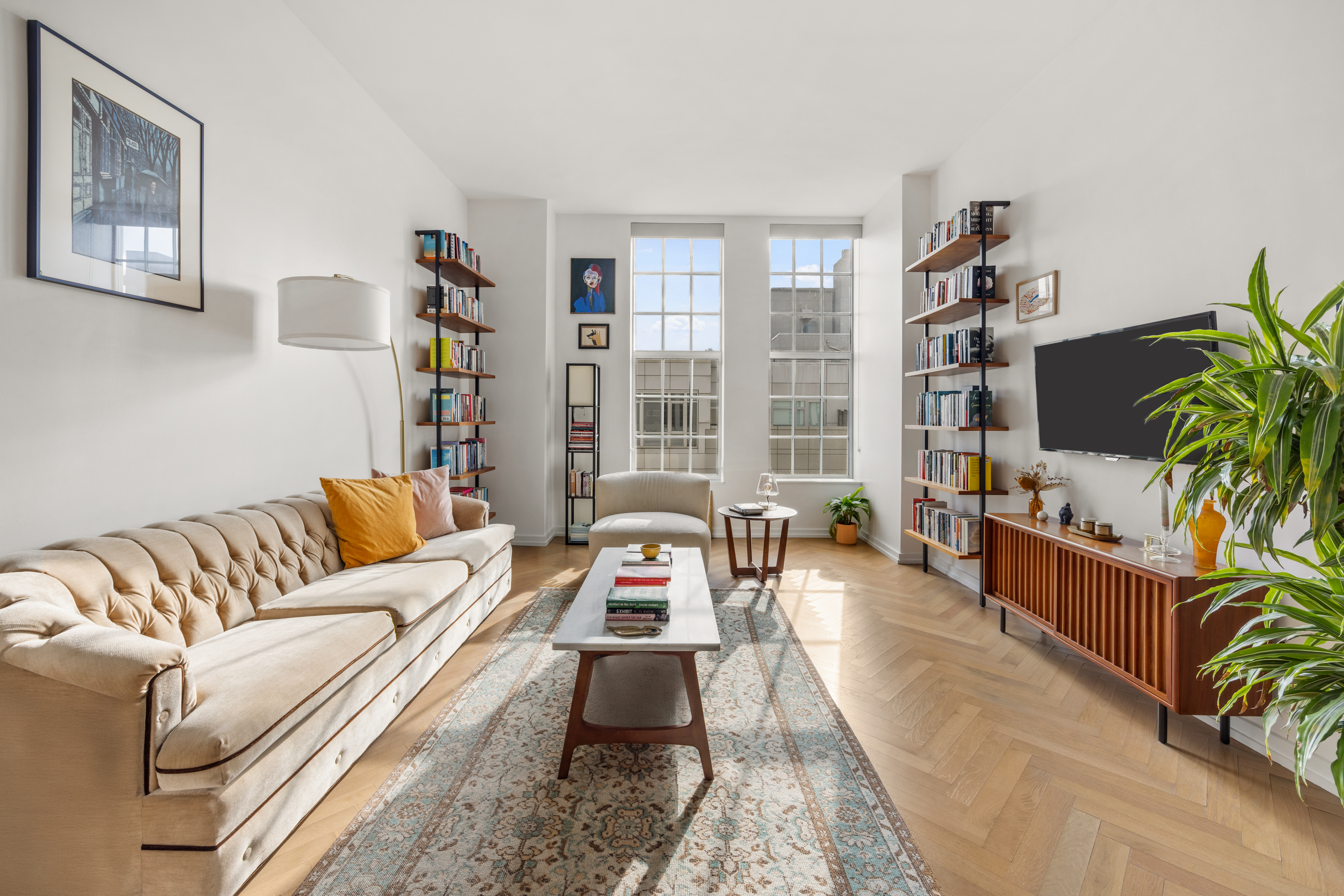 184 Kent Avenue, Unit A617 Brooklyn, NY 11249 - Photo 1 of 14 a living room with furniture fireplace and flat screen tv