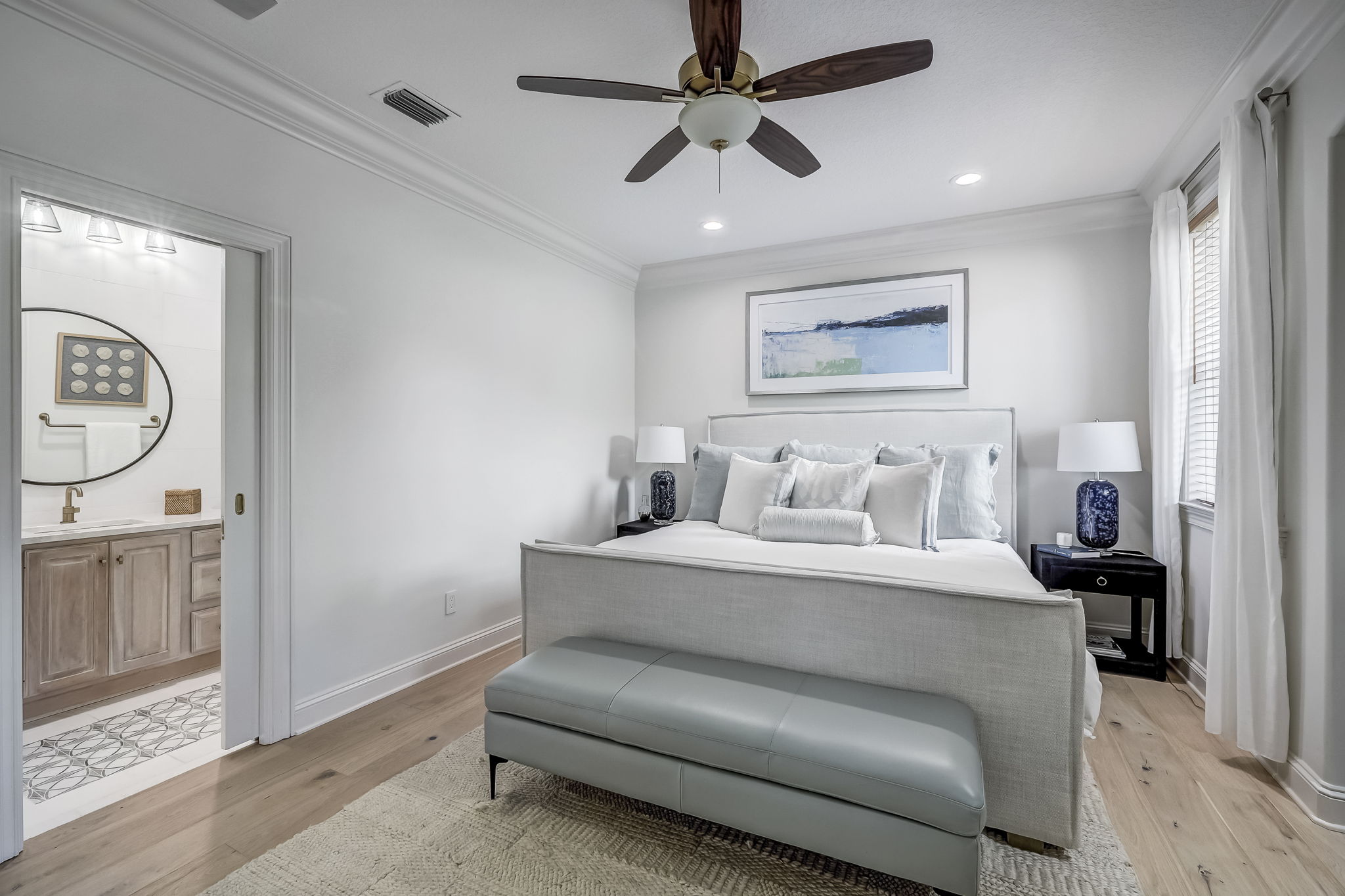 24624 Harbour View Drive Ponte Vedra Beach, FL 32082 - Photo 78 of 186 a spacious bedroom with a bed and a chandelier