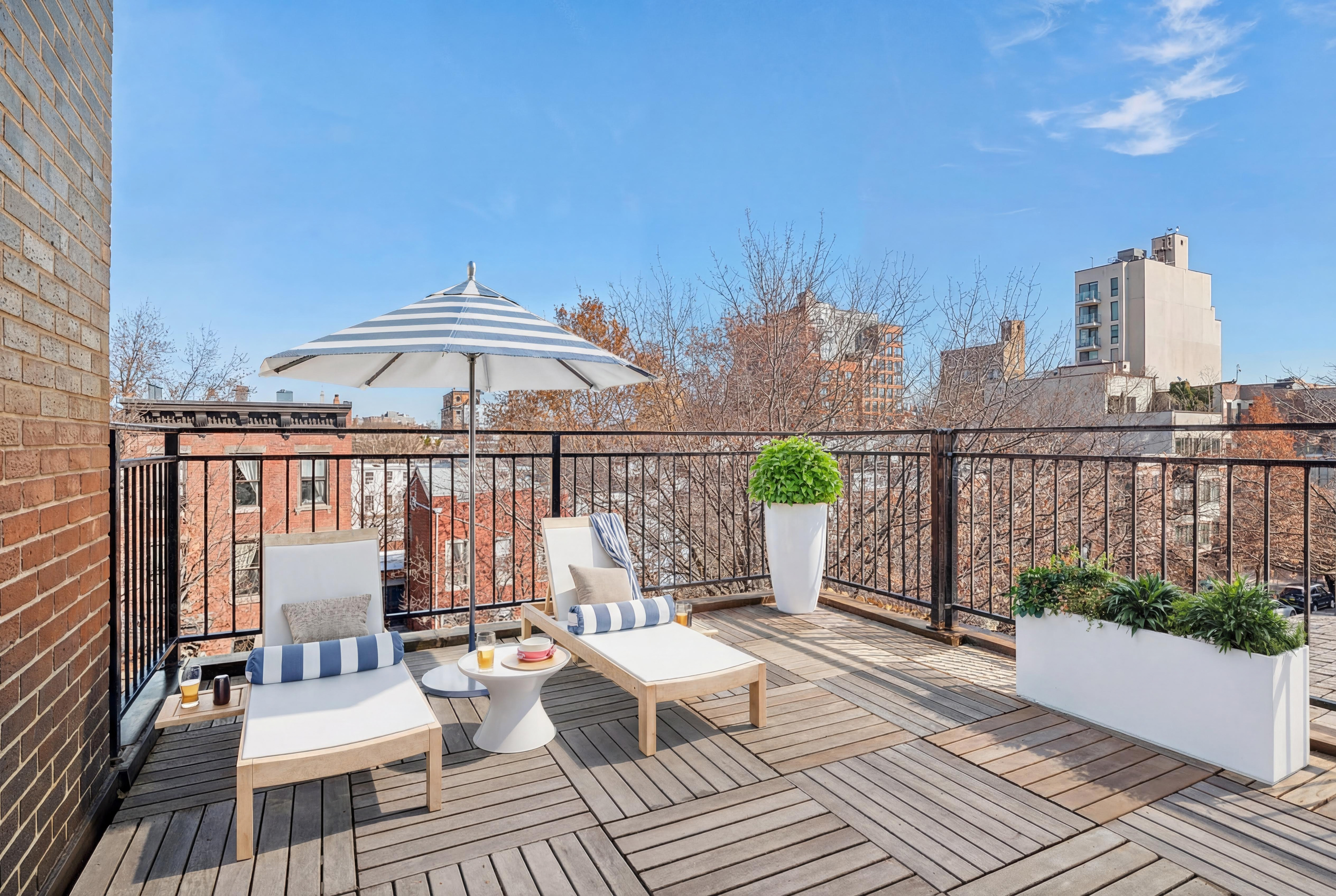 176 12th Street, Unit 3 Brooklyn, NY 11215 - Photo 2 of 11 a view of a balcony with two chairs and a table