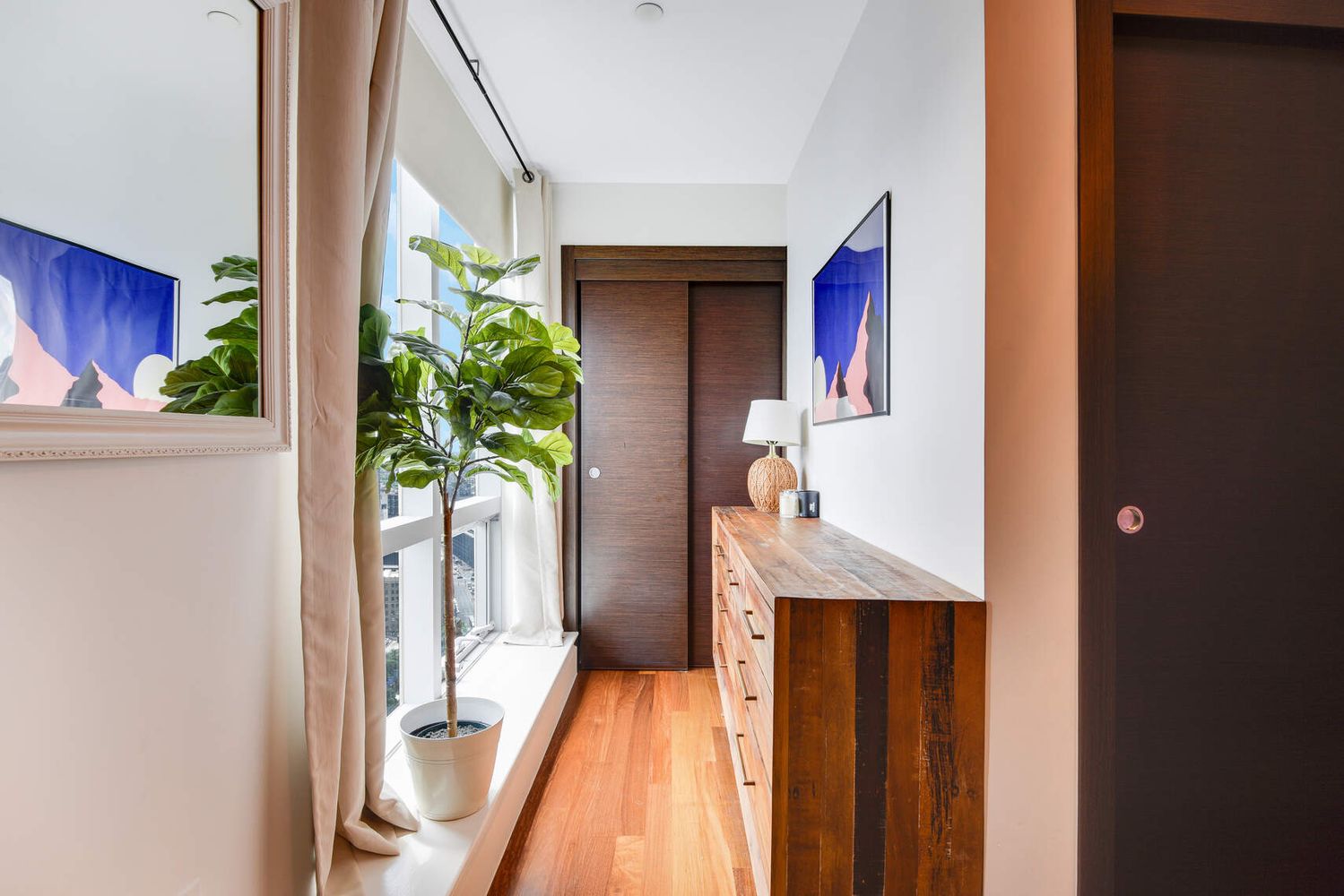 150 Myrtle Avenue, Unit PH3201 Brooklyn, NY 11201 - Photo 22 of 40 a view of a hallway with paintings on the wall