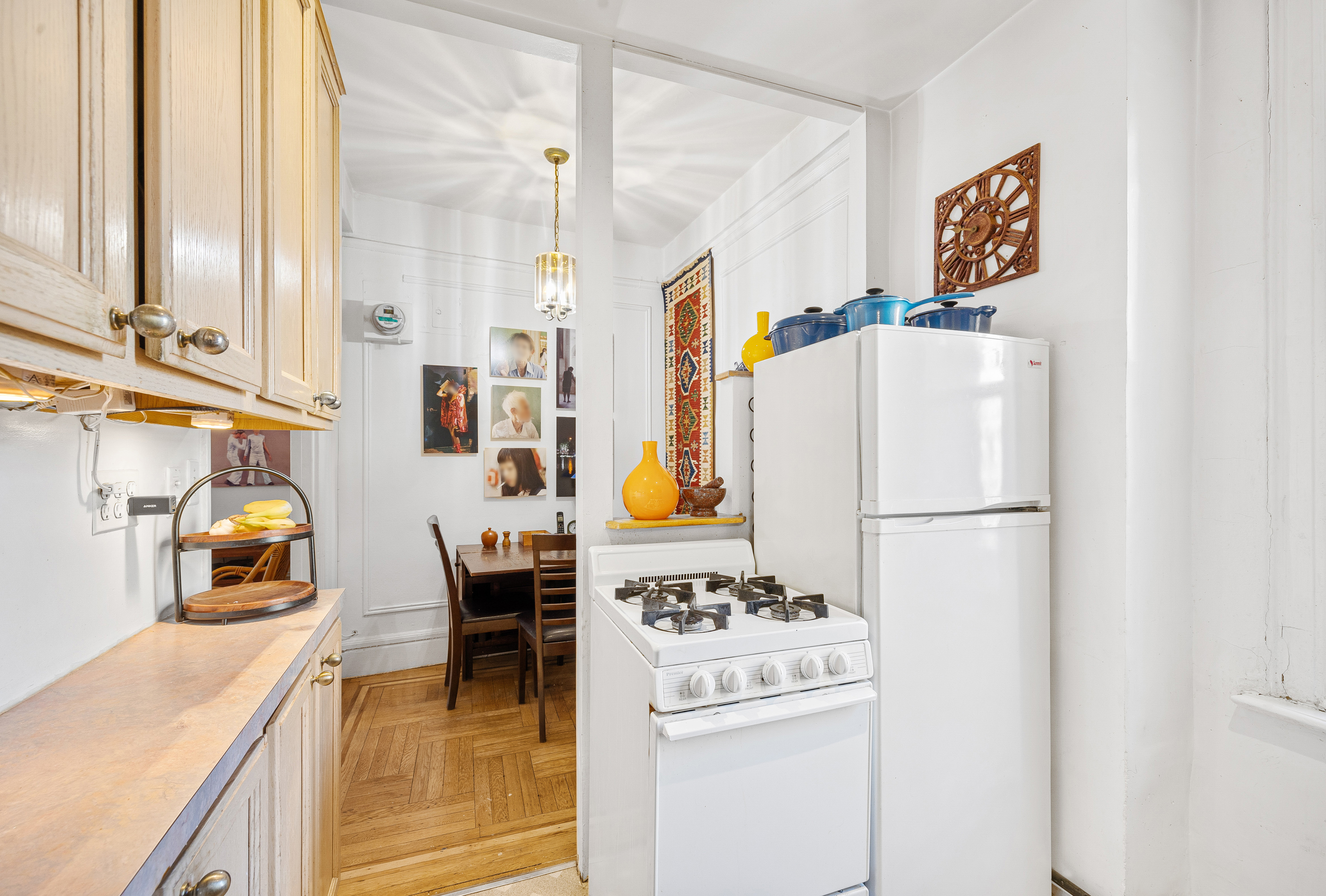 269 West 72nd Street, Unit 9B Manhattan, NY 10023 - Photo 5 of 13 a kitchen with a refrigerator a stove a washer and a sink