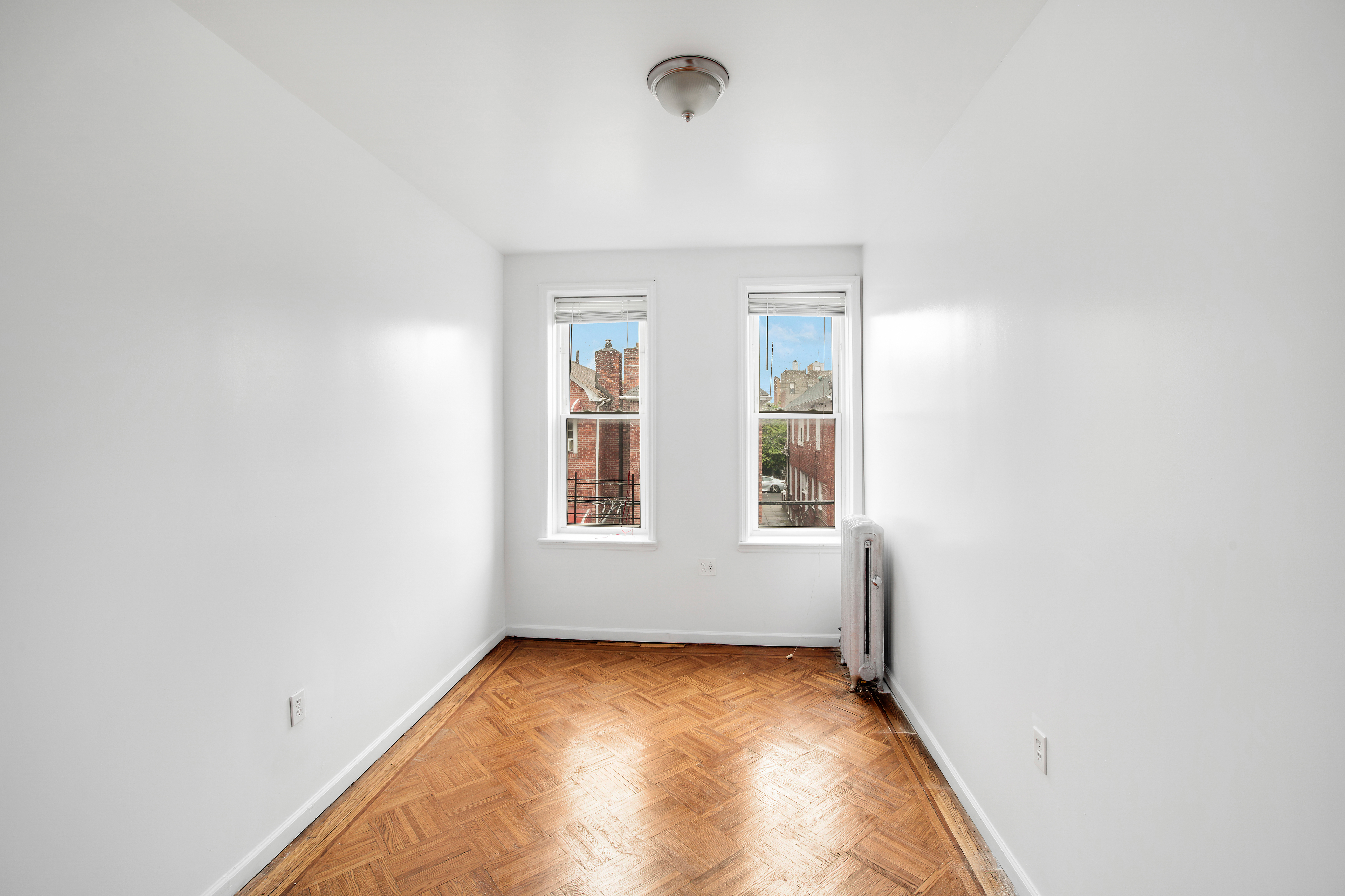 361 East 54th Street, Unit 2R Brooklyn, NY 11203 - Photo 7 of 9 an empty room with windows