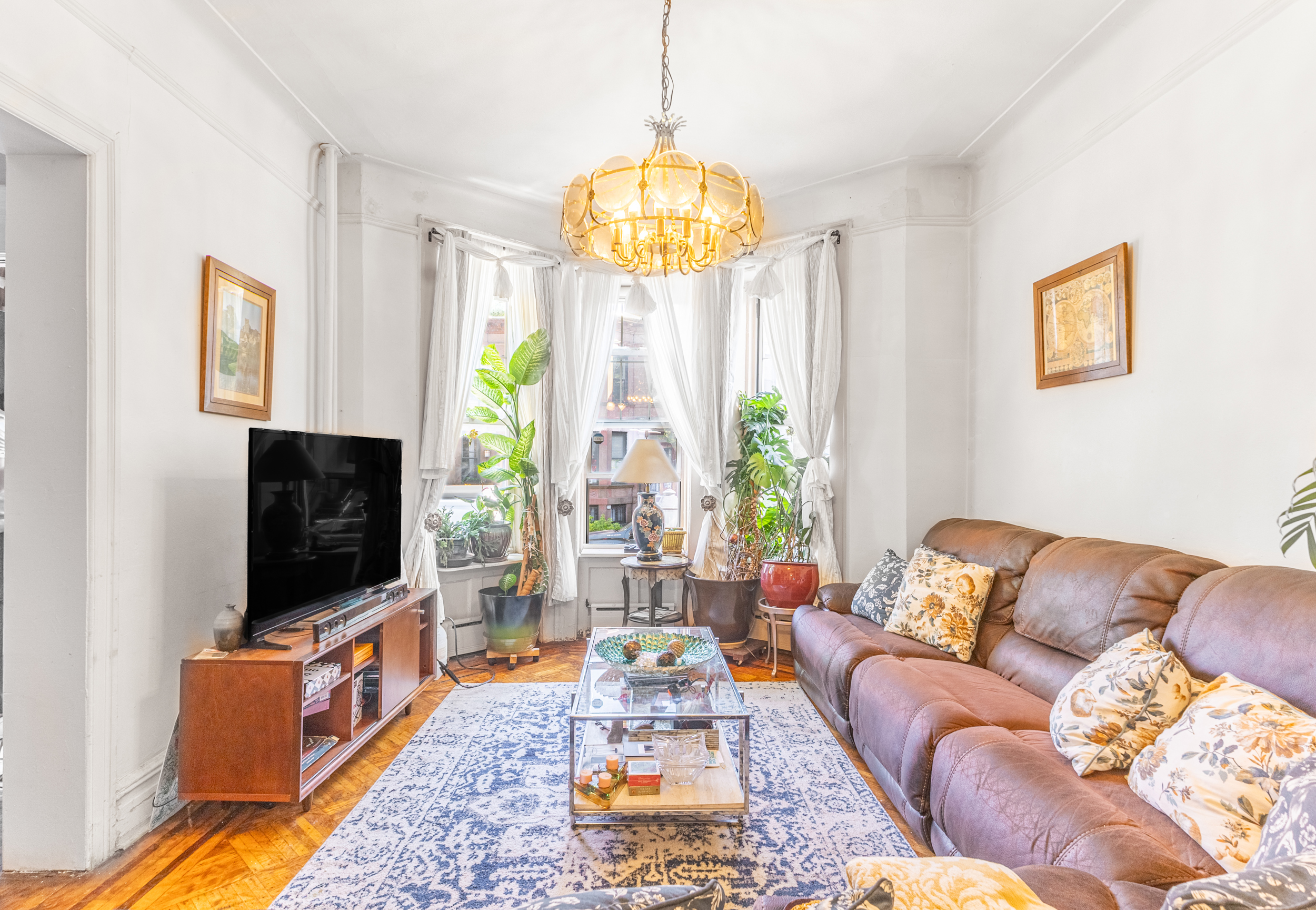 201 Maple Street Brooklyn, NY 11225 - Photo 3 of 21 a living room with furniture and a flat screen tv