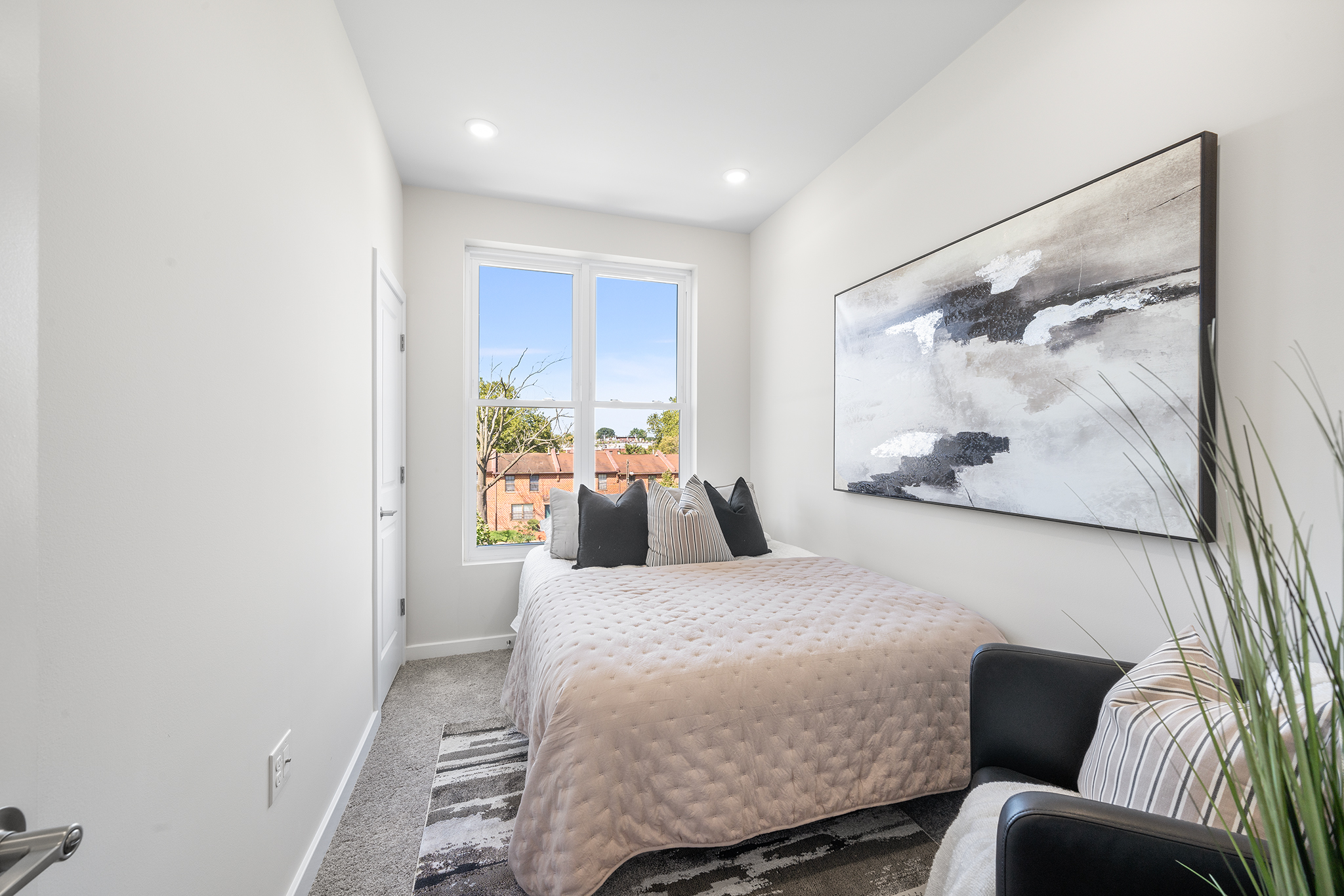 534 North 54th Street, Unit A Philadelphia, PA 19131 - Photo 17 of 22 a bedroom with a bed couch and painting on the wall