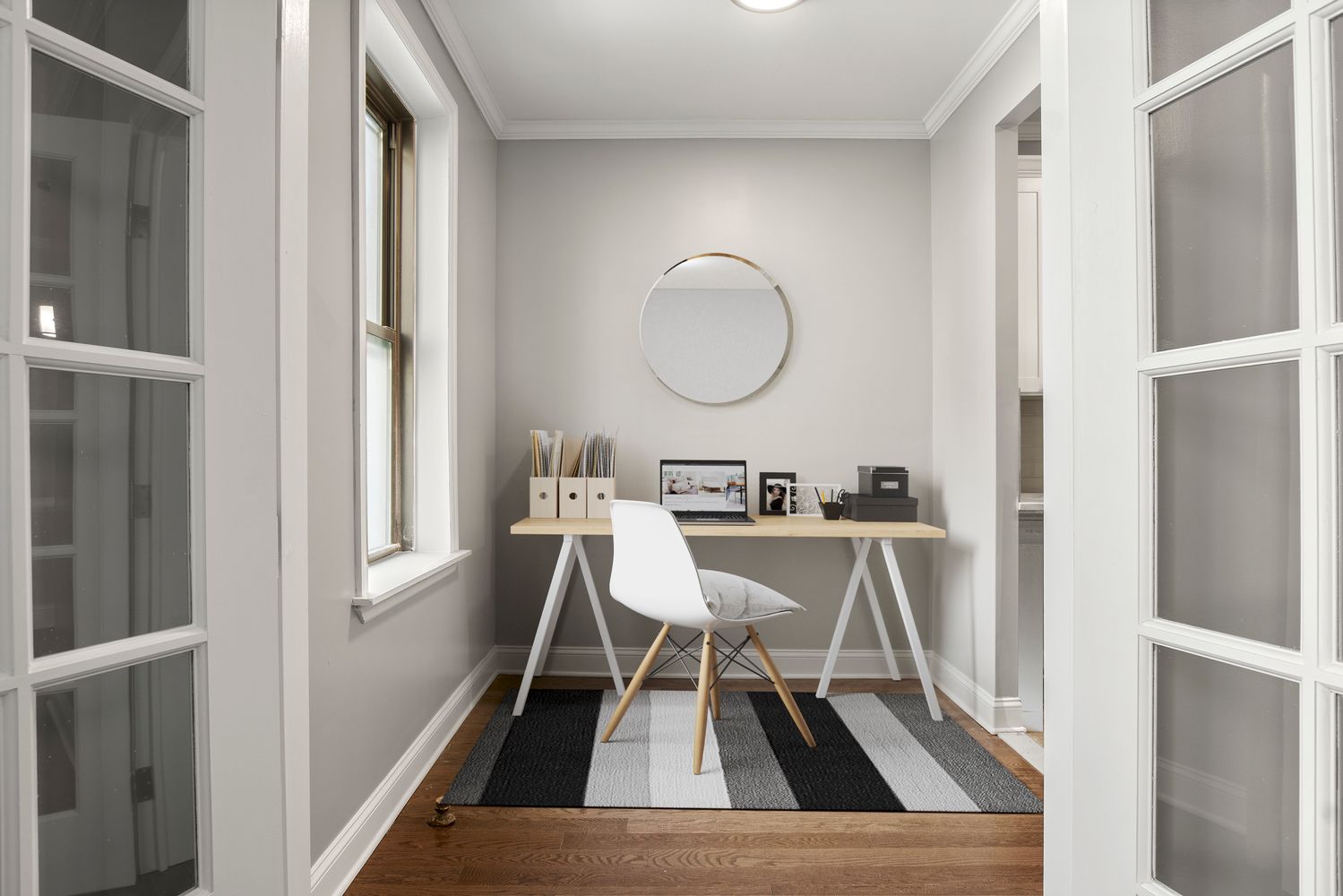 a view of a room that has a bed and a chair in it