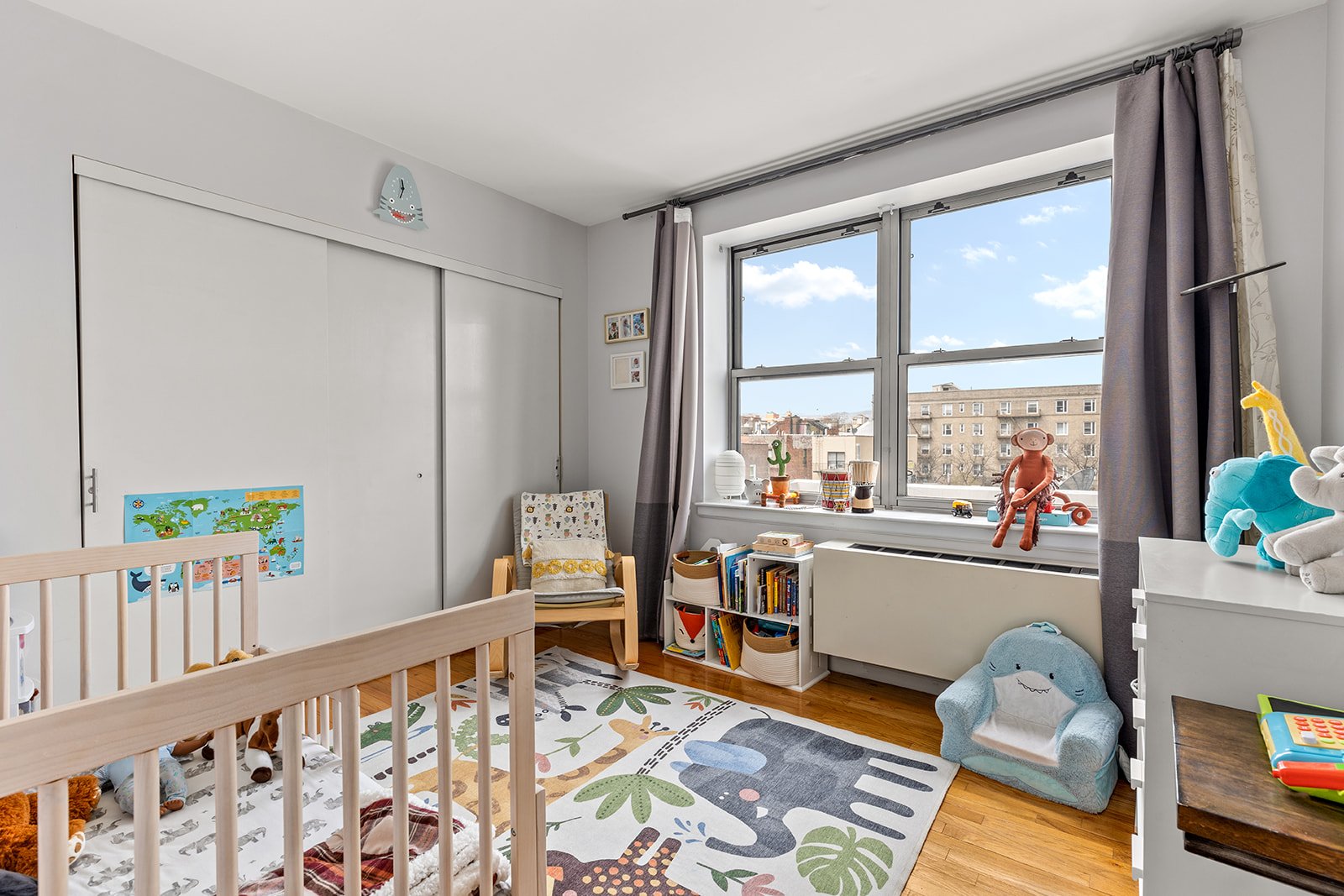 4102 Queens Boulevard, Unit 3D Queens, NY 11104 - Photo 4 of 7 a bedroom with furniture and a window