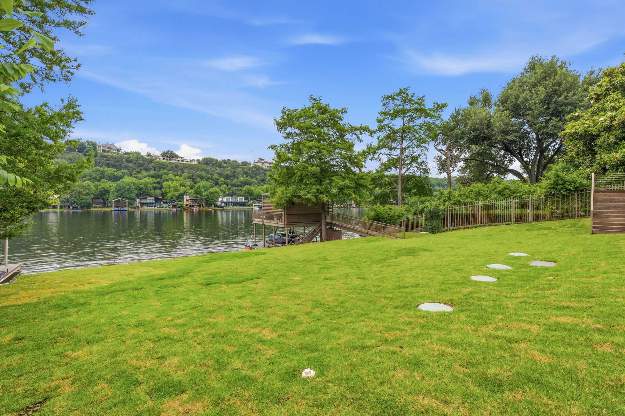 3605 Robbins Road Austin, TX 78730 - Photo 32 of 51 a view of a lake with a big yard
